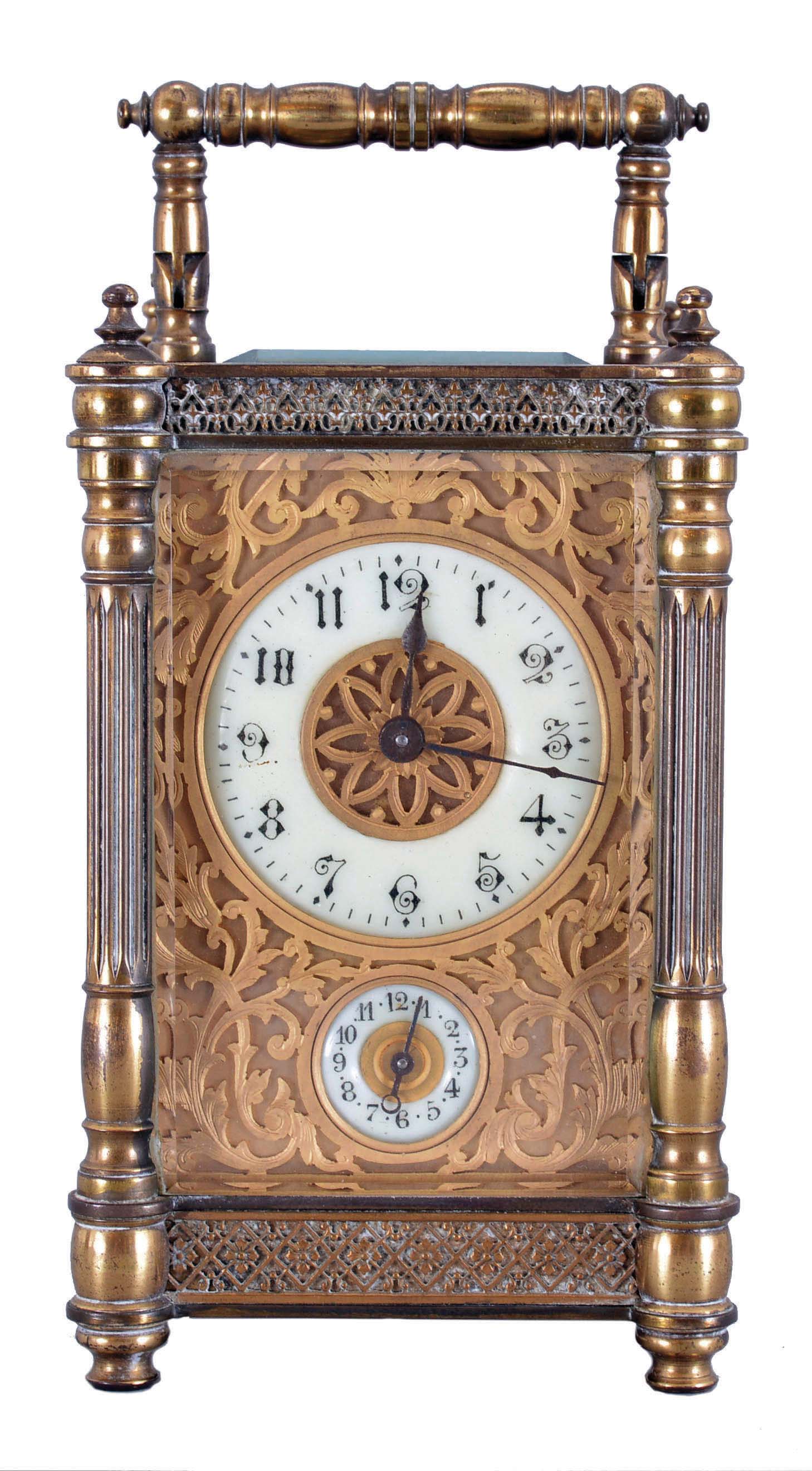 France, carriage clock with alarm, brass case with columns at the corners, turned feet and finials, and blind fret trim at top and base, Arabic numeral white enamel dial with gilt, filigree mask, 8 day time and alarm movement with lever platform, with leather covered outer case — Antique Clocks Price Guide