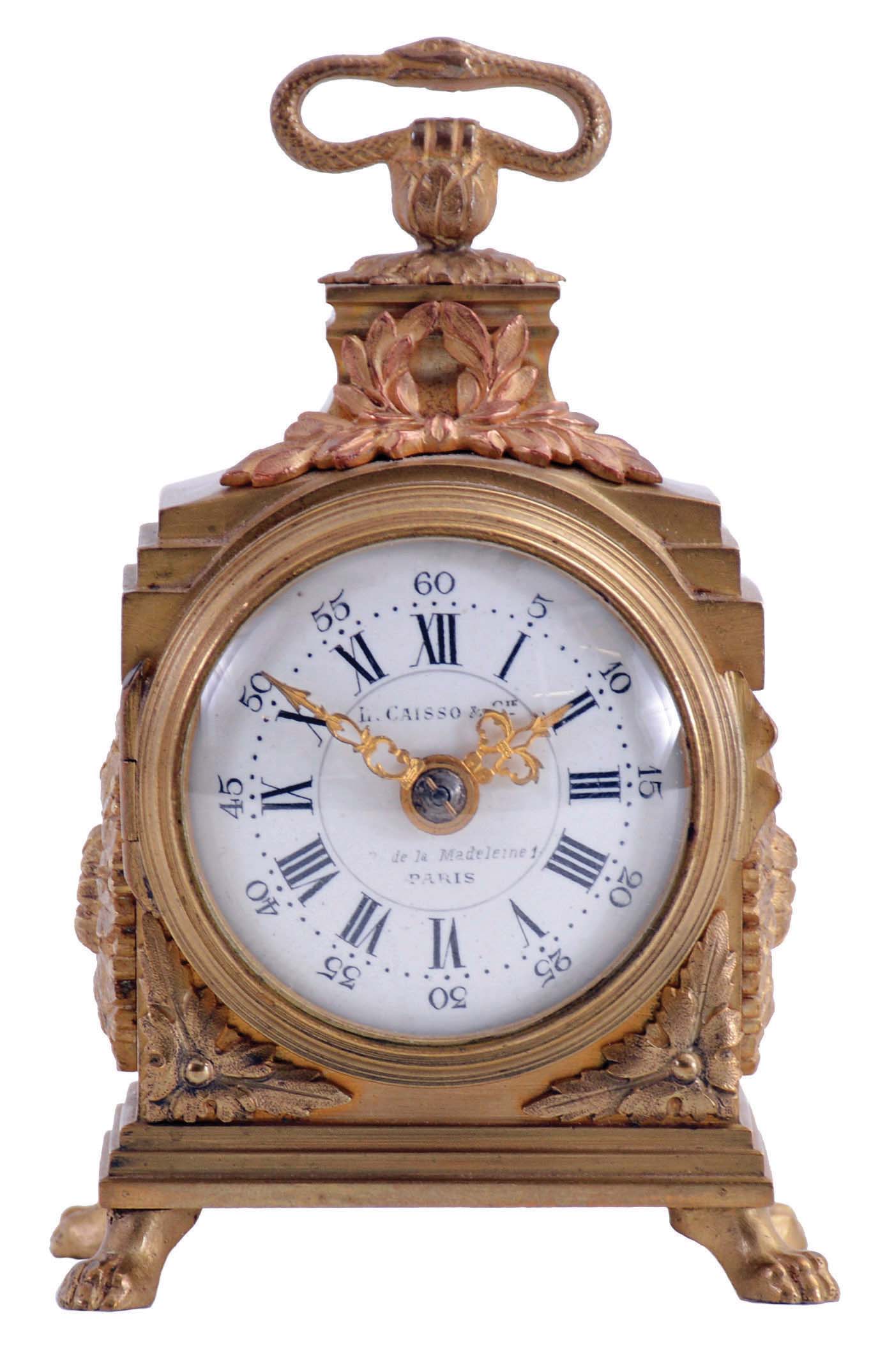 L. Caisso &amp; Cie., Paris, desk or bedside clock, miniature pendule de officier style gilt case with applied ornament, Roman numeral convex white enamel dial, gilt Louis XV style hands, 8 day, key wound timepiece movement with cylinder platform — Antique Clocks Price Guide