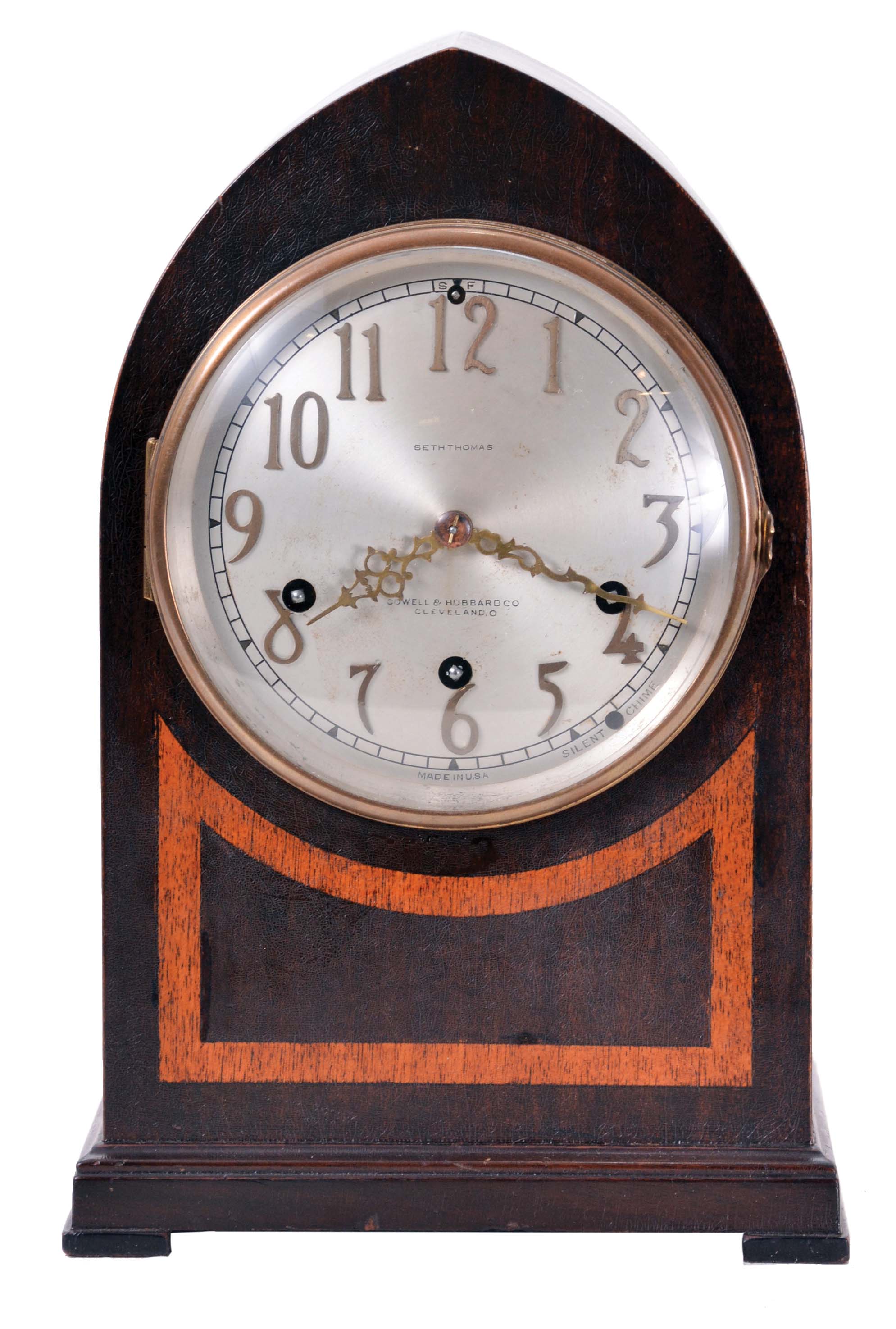 Seth Thomas Clock Co., Thomaston, Conn., "Chime No. 95" shelf clock with an eight day spring driven time and Westminster strike movement (124A) chiming on rods, in a two tone mahogany veneered case with a silvered dial and raised bronze numerals. — Antique Clocks Price Guide