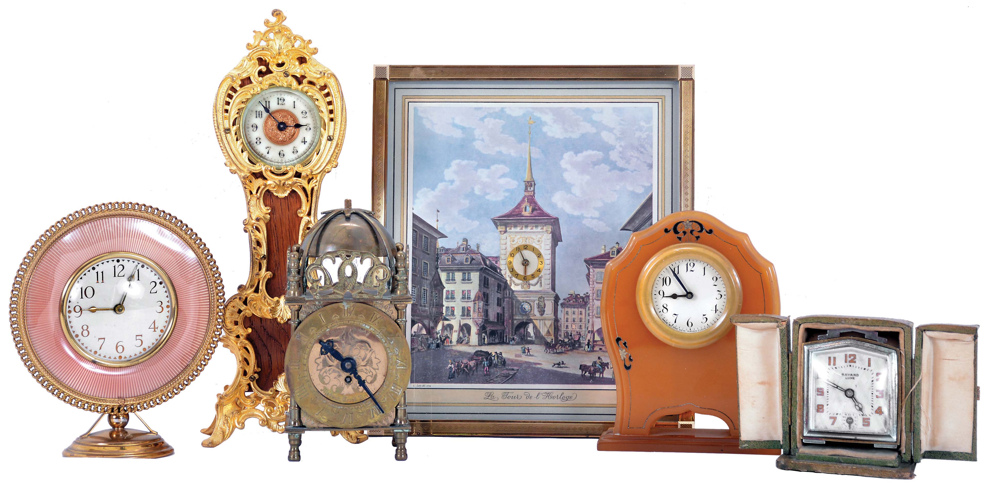 Clocks- 6 (Six): including an Ansonia miniature tall clock, a "Smiths" miniature lantern clock, a "Bayard - Luxe" travel alarm with outer case, a Bulova Swiss picture frame clock, and two others, mechanical and electric movements — Antique Clocks Price Guide