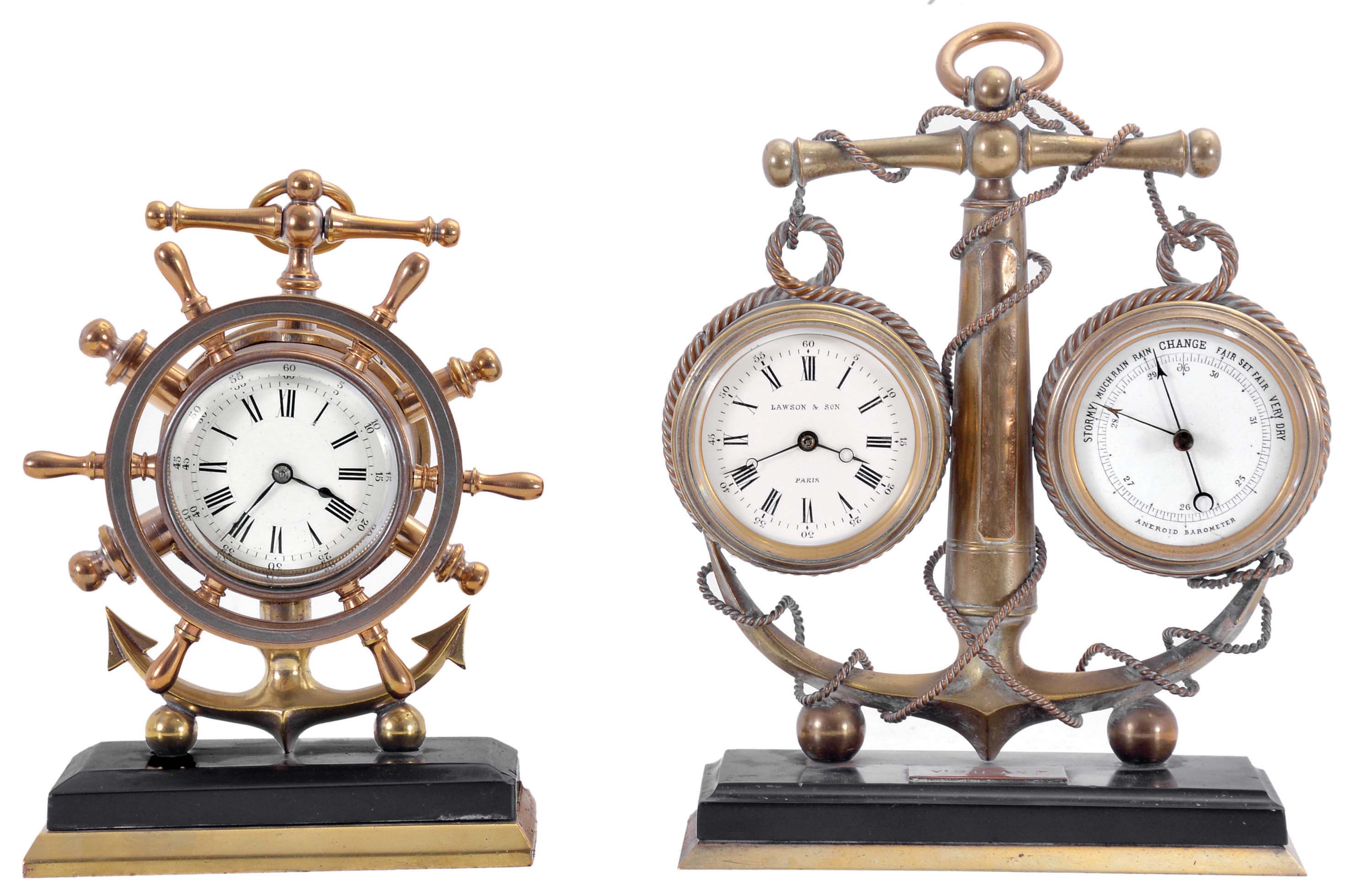 Clocks- 2 (Two): Both with nautical theme, the first signed "Lawson &amp; Son Paris", brass trimmed, black slate base supporting a brass anchor encircled by rope, and with 8 day timepiece and barometer, both with white enamel dials, and rectangular plaque engraved "Vigilant", the other also with brass trimmed, black slate base supporting a brass anchor and 8 day timepiece with white enamel dial, the bezel with ships wheel surround, dimensions of larger piece listed — Antique Clocks Price Guide