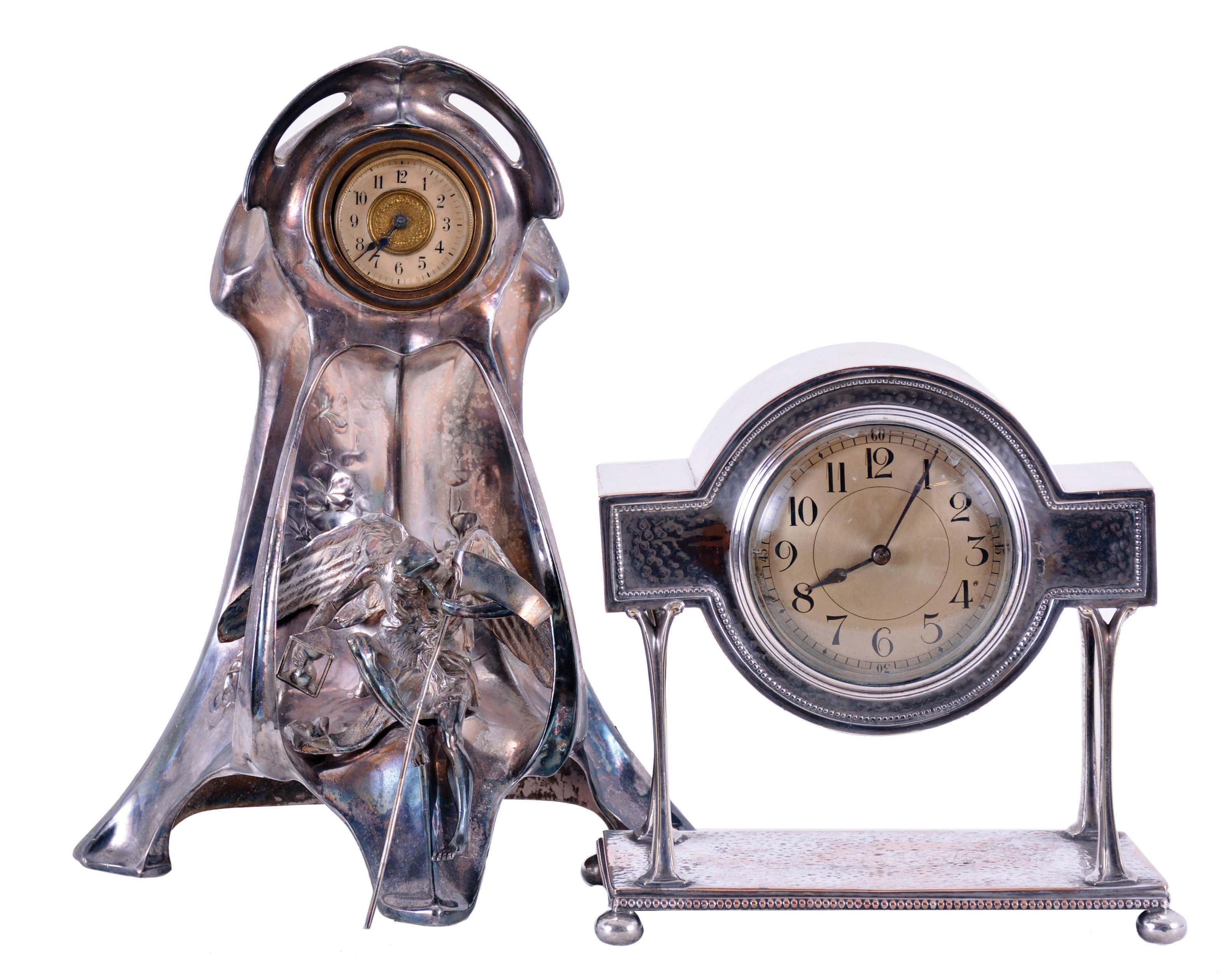 Clocks- 2 (Two): (1) German, the polished pewter, art nouveau style case with figure of Chronos with his hourglass and scythe and 8 day Junghans timepiece movement, (2) Arts and crafts style, with hammered and cast Sheffield plate case, Arabic numeral metal dial, and French 8 day timepiece movement — Antique Clocks Price Guide