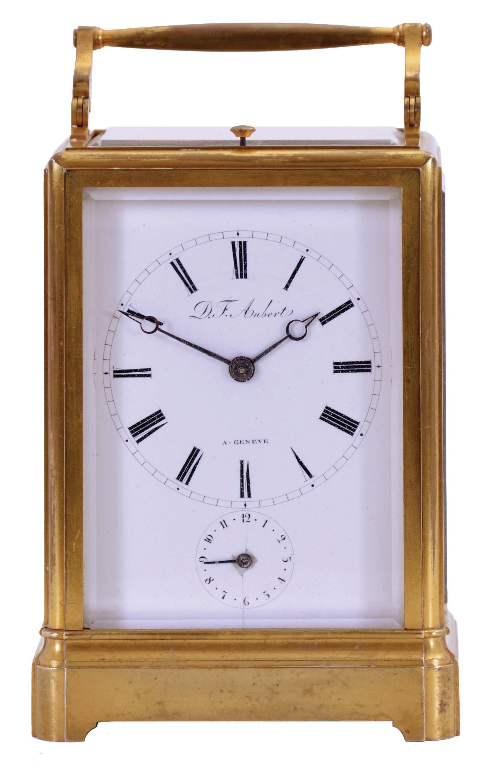 D.F. Aubert, a Geneve, grand sonnerie striking carriage clock with alarm and repeat, gilt one piece case with beveled glasses, Roman numeral white enamel dial, blued steel Breguet style hands, 8 day movement with lever platform, striking grand or petite sonnerie quarters in passing, and repeating on demand — Antique Clocks Price Guide