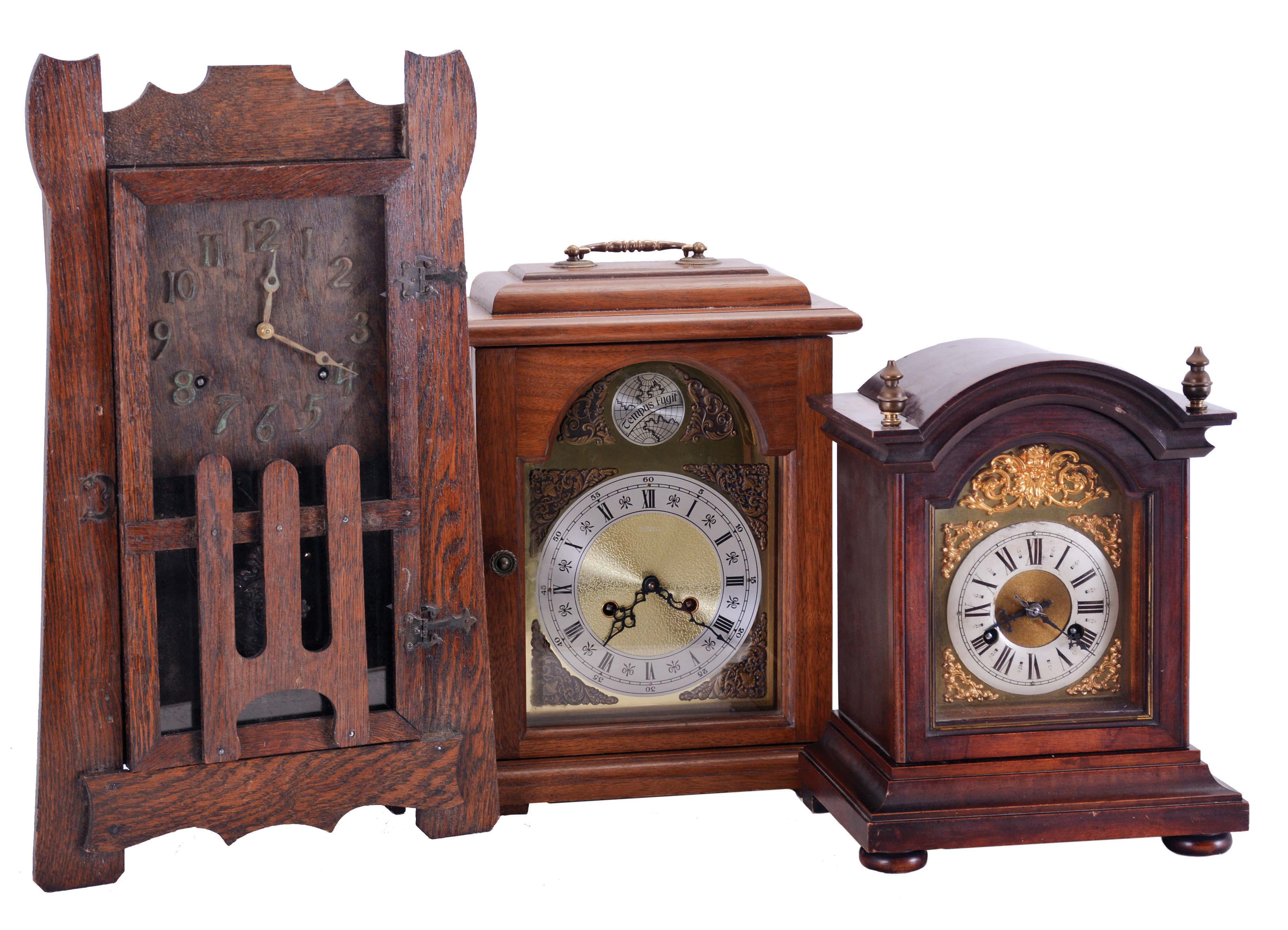 Clocks- 3 (Three) Mantel: (1) American, Mission oak shelf clock, 8 day time and strike, c1910; (2) Junghans, Germany, 8-day time &amp; quarter strike bracket clock in a mahogany case, c1915; (3) German, modern bracket clock with floating balance movement in a walnut case, 1976. — Antique Clocks Price Guide
