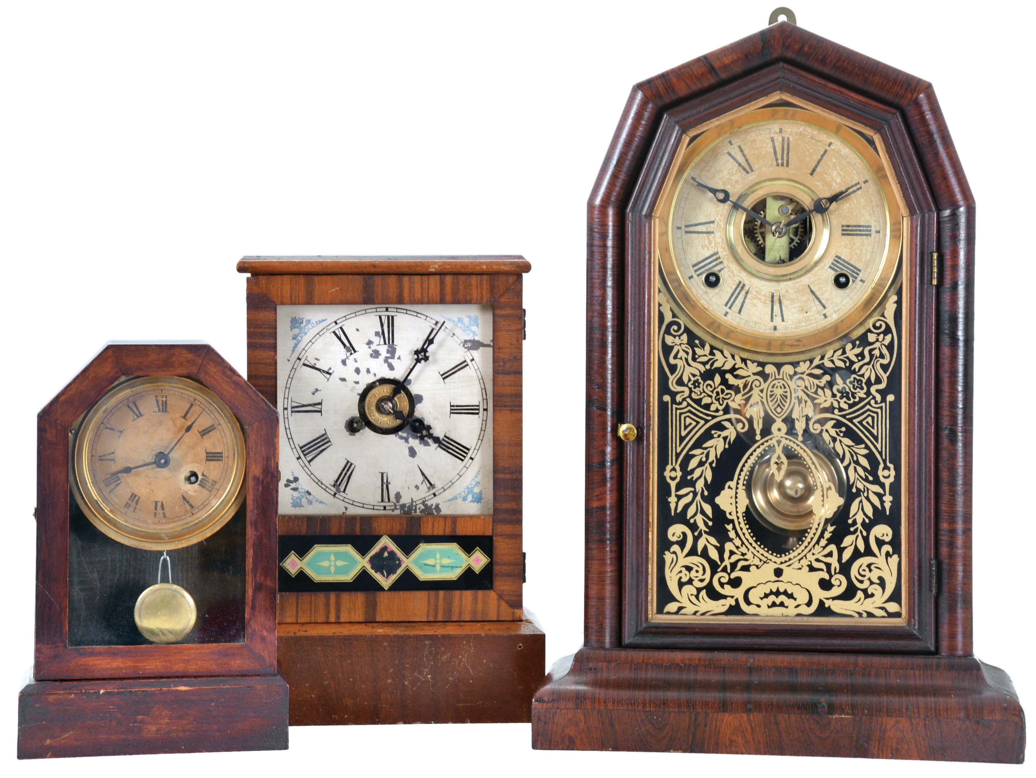 Clocks- 3 (Three): (1) E. N. Welch Mfg. Co., Forestville, Conn., "Empress V.P." shelf clock with a spring driven, 8 day, time and strike movement in a rosewood veneered case, c1880; (2) Unidentified American Cottage clock, probably Waterbury, with a spring driven 30 hour time and alarm movement in a rosewood veneered case, c1870; (3) The Terry Clock Co., Waterbury, Conn., Cottage clock with a spring driven 30 hour timepiece movement in a mahogany veneered case, c1870. — Antique Clocks Price Guide