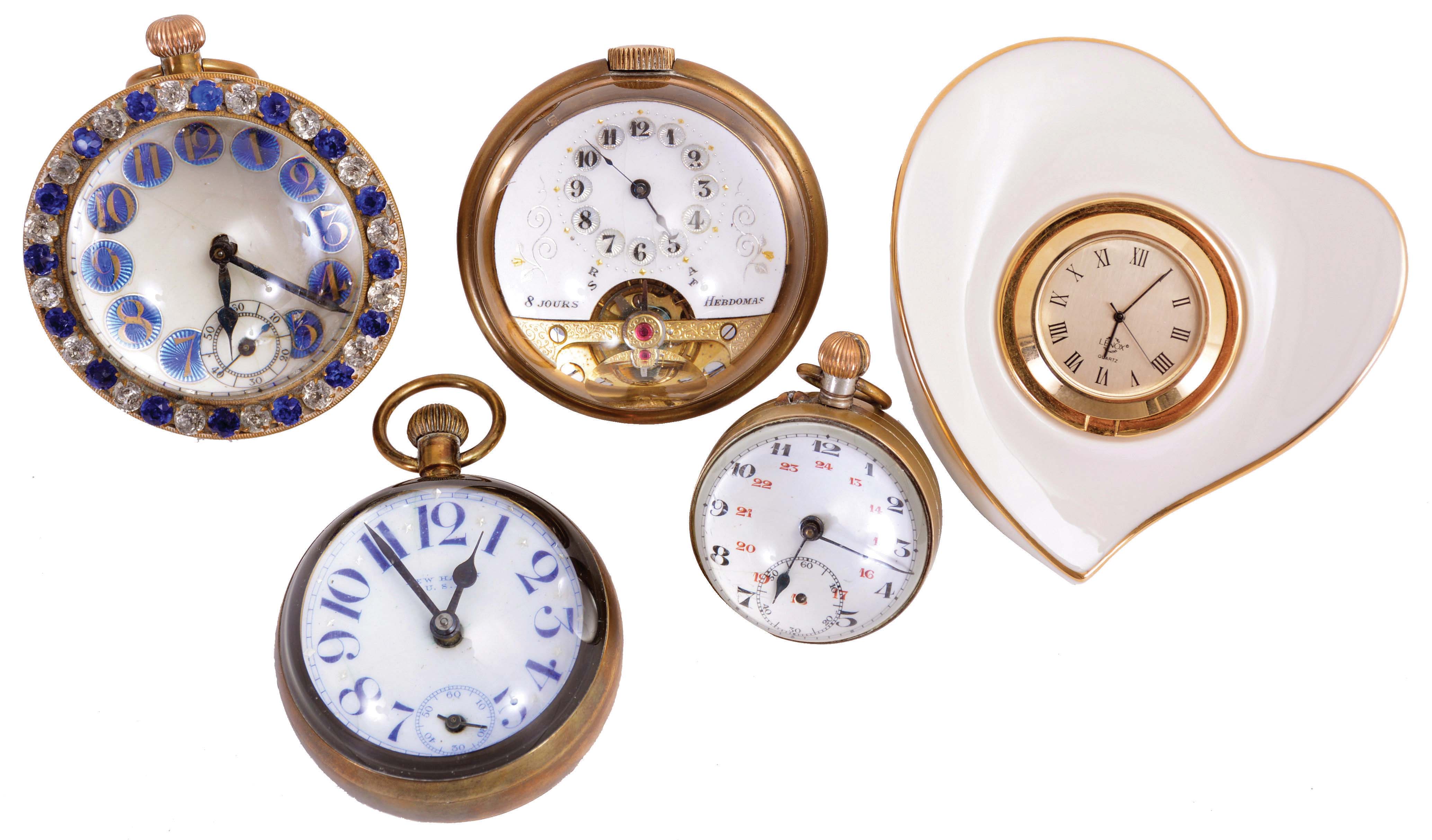 Clocks- 5 (Five): Four paperweight clocks, one an 8 day "Hebdomas", another 8 day Swiss with brilliant set bezel, a 30 hour Swiss with Arabic numeral enamel dial, a New Haven, and a heart shaped "Lenox" with quartz movement — Antique Clocks Price Guide
