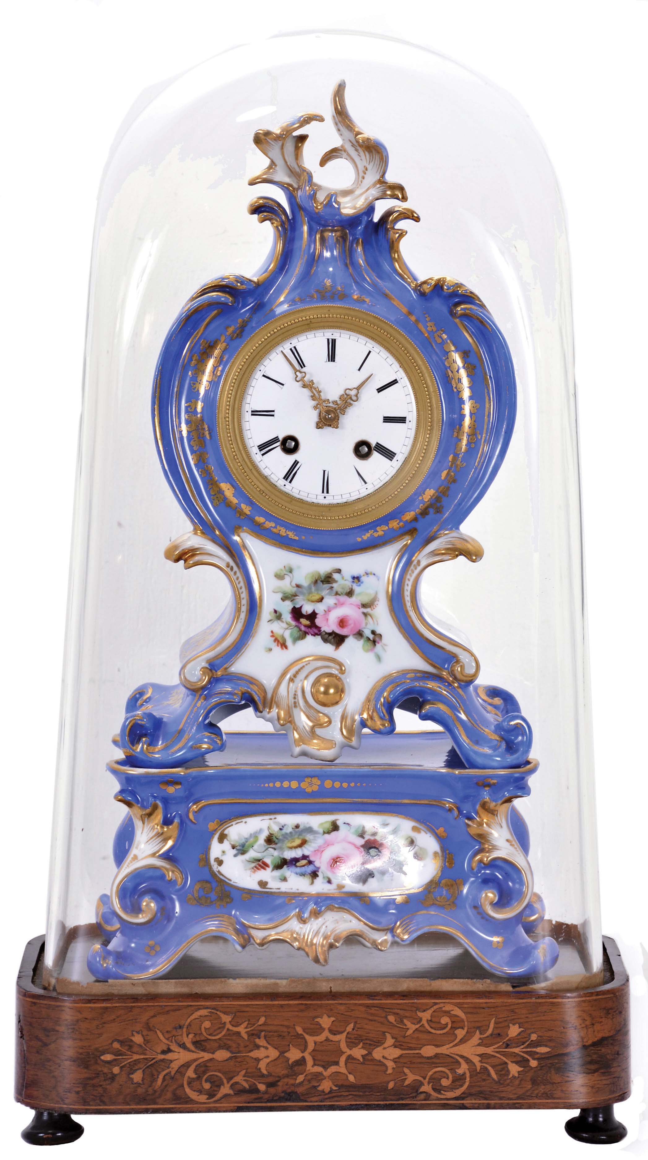 France, a two part, rococo style porcelain mantel clock with case in the style of Jacob Petit, the clock and stand both decorated with molded and brightly painted naturalistic ornament, blue ground highlighted by bright gilding, all resting on an inlaid rosewood base with dome, Roman numeral white enamel dial, unusual, fancy gilt trefoil hands, 8 day, time and strike, pendule de Paris movement with silk thread suspension, the back plate marked "Medaille d'or Japy" — Antique Clocks Price Guide
