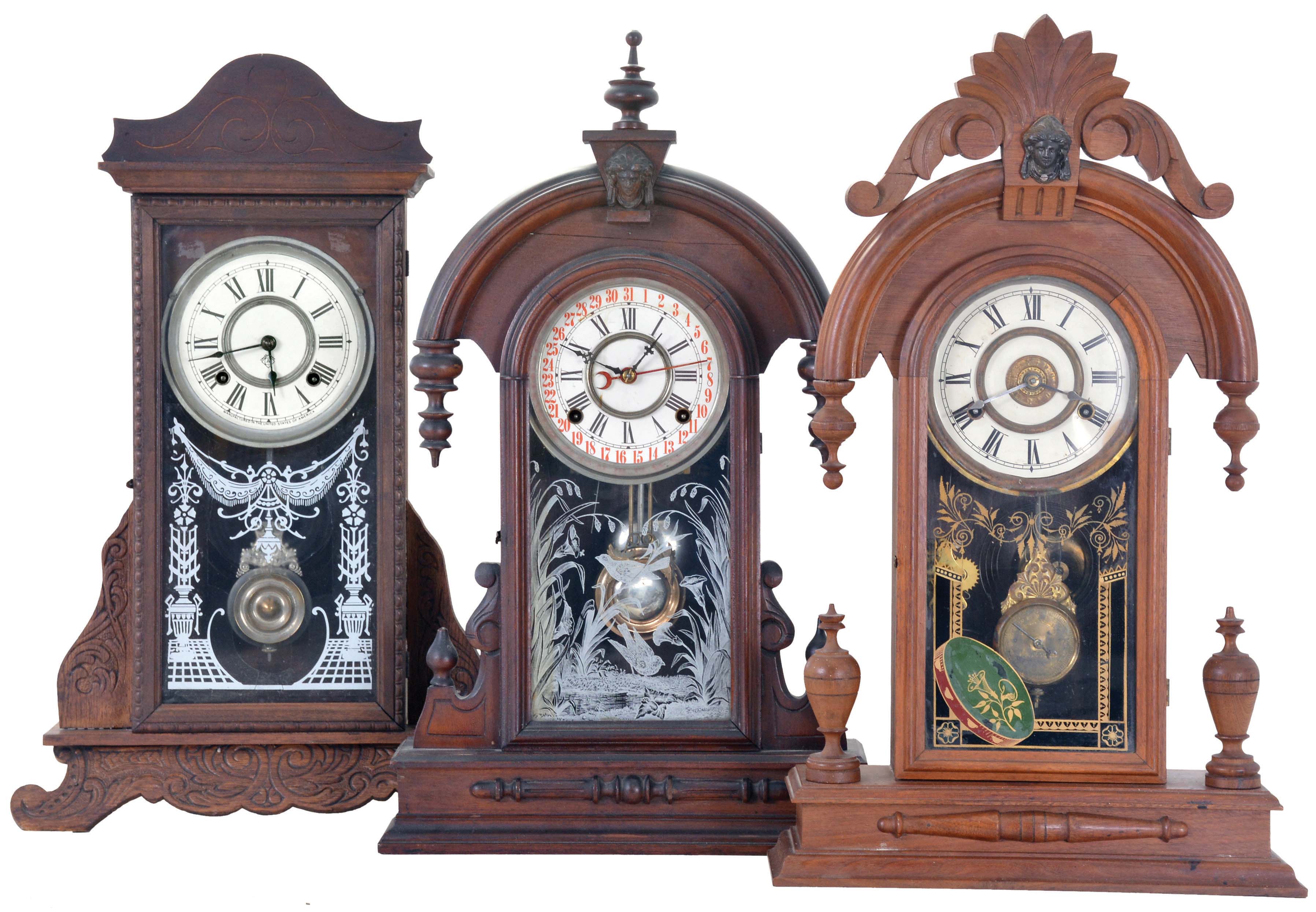 Clocks- 3 (Three): (1) Ansonia Clock Co., New York, unidentified shelf clock with a spring driven, 8 day time and half hour strike movement in an oak case, c1910. ; (2) William L. Gilbert Clock Co., Winsted, Conn., "Parisian - Walnut" shelf clock with a spring driven, 8 day, time and strike movement with a simple calendar mechanism in a walnut case, c1885; (3) New Haven Clock Co., New Haven, Conn., "No. 503" shelf clock with a spring driven, 8 day time, strike and alarm movement in a black walnut case, c1886. — Antique Clocks Price Guide