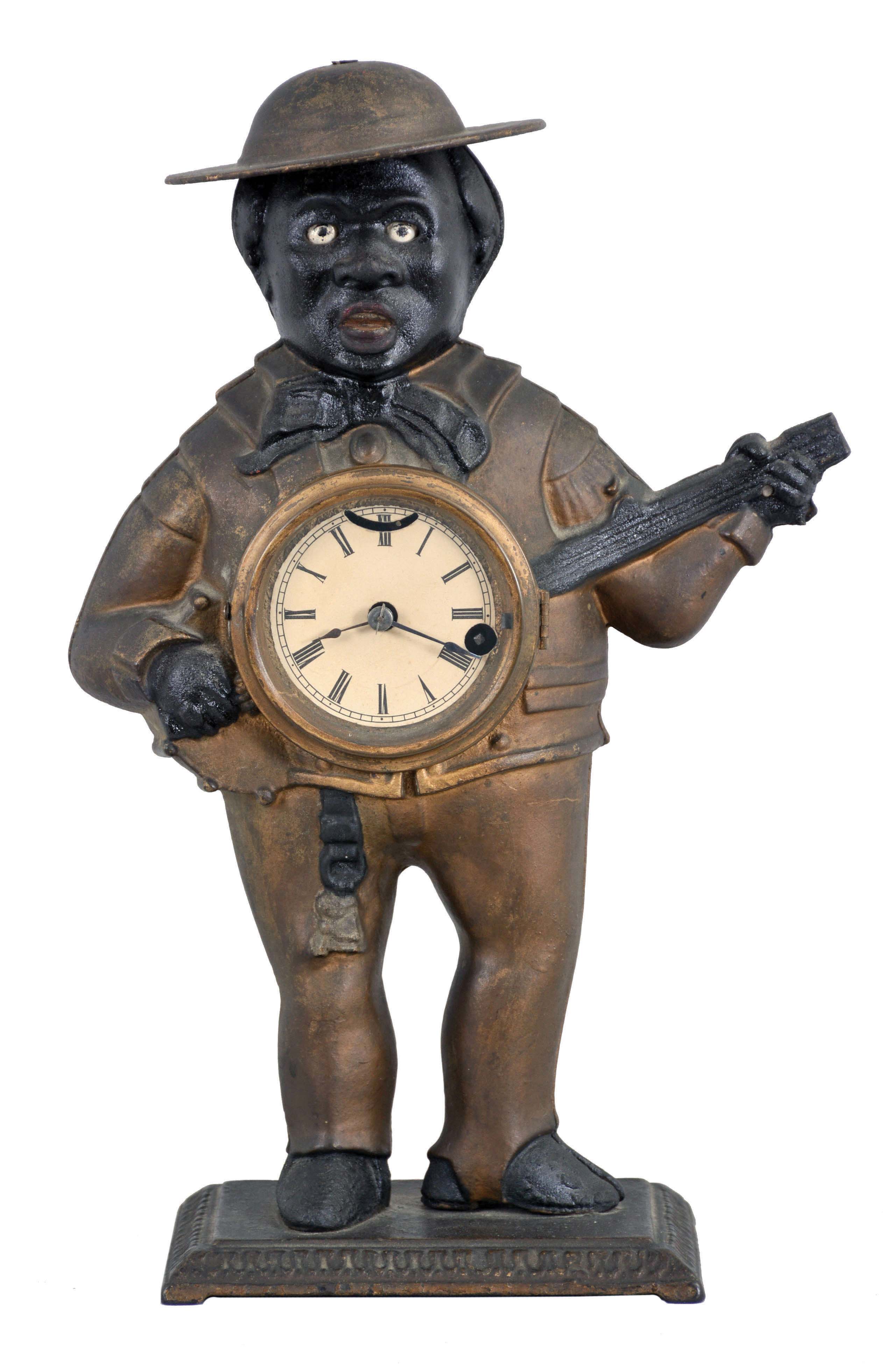Bradley and Hubbard, Meriden, Conn., "Sambo" blinking eye clock with a spring driven balance wheel timepiece movement (unsigned) in a cast iron case. — Antique Clocks Price Guide