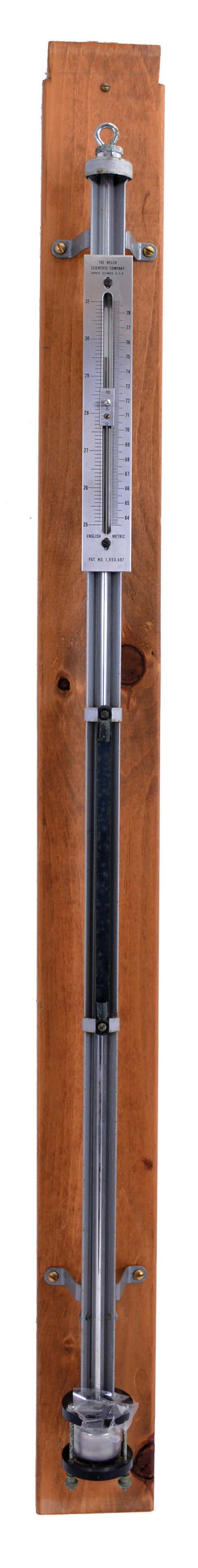Welch Scientific Co., Skokie, Illinois, "Standard Mercurial Barometer" on wood backboard. This type of barometer was used by the United States Weather Bureau and other laboratories. 6mm heavy-walled glass tube, vacuum filled with mercury. Double-scale made of non-tarnishing nickel silver. — Antique Clocks Price Guide
