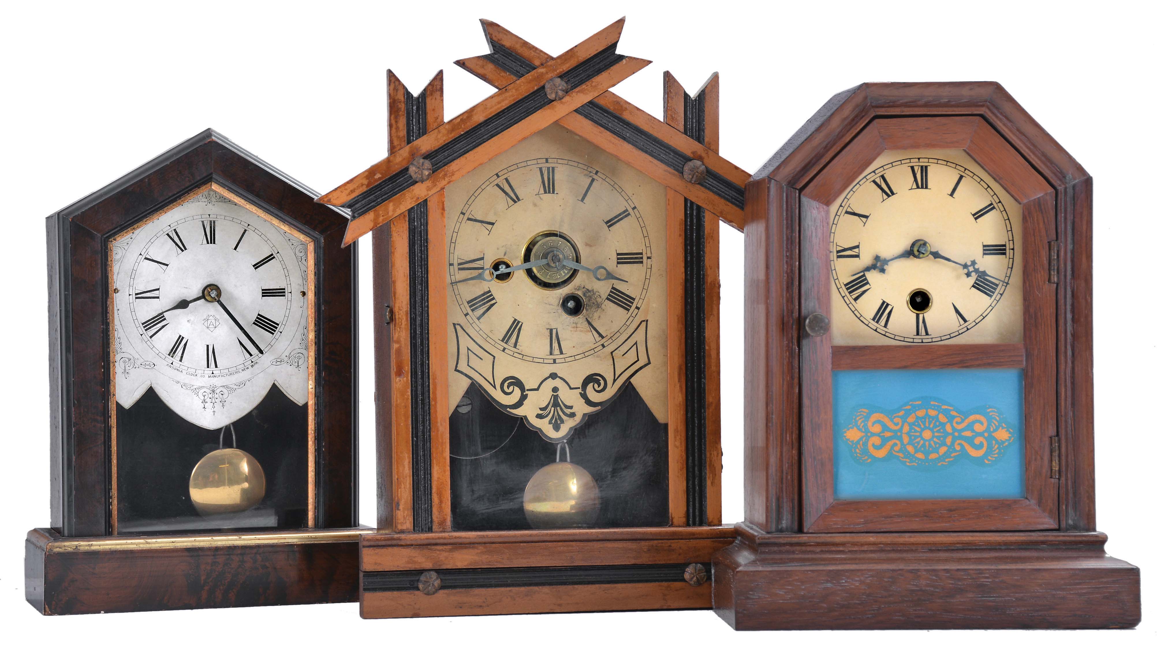 Clocks- 7 (Seven): (1) Ansonia Clock Co., New York, unidentified cottage shelf clock with a spring driven 30 hour timepiece movement in a wood case, c1890; (2) E. Ingraham &amp; Co., Bristol, Conn., "OK" shelf clock with a spring driven 30 hour time and alarm movement in a light wood case, c1884; (3) Jerome and Co., New Haven, Conn., unidentified cottage shelf clock with a spring driven 30 hour movement in a rosewood veneered case, c1870; (4) Jerome &amp; Co., New Haven, Conn., "Rose Cottage" shelf clock with a spring driven 30 hour time and alarm movement in a rosewood veneered case, c1870; (5) Seth Thomas Clock Co., Thomaston, Conn., cottage shelf clock with a spring driven 30 hour movement in a rosewood and mahogany veneered case, c1875; (6) Badenia Clock Manufactory, Bavaria, Germany cottage shelf clock with a spring driven 30 hour time and alarm movement in a grained wooden case, c1870; (7) Seth Thomas Clock Co., Plymouth Hollow, Conn. cottage shelf clock with a spring driven time and alarm movement in a rosewood veneered case, c1860. — Antique Clocks Price Guide