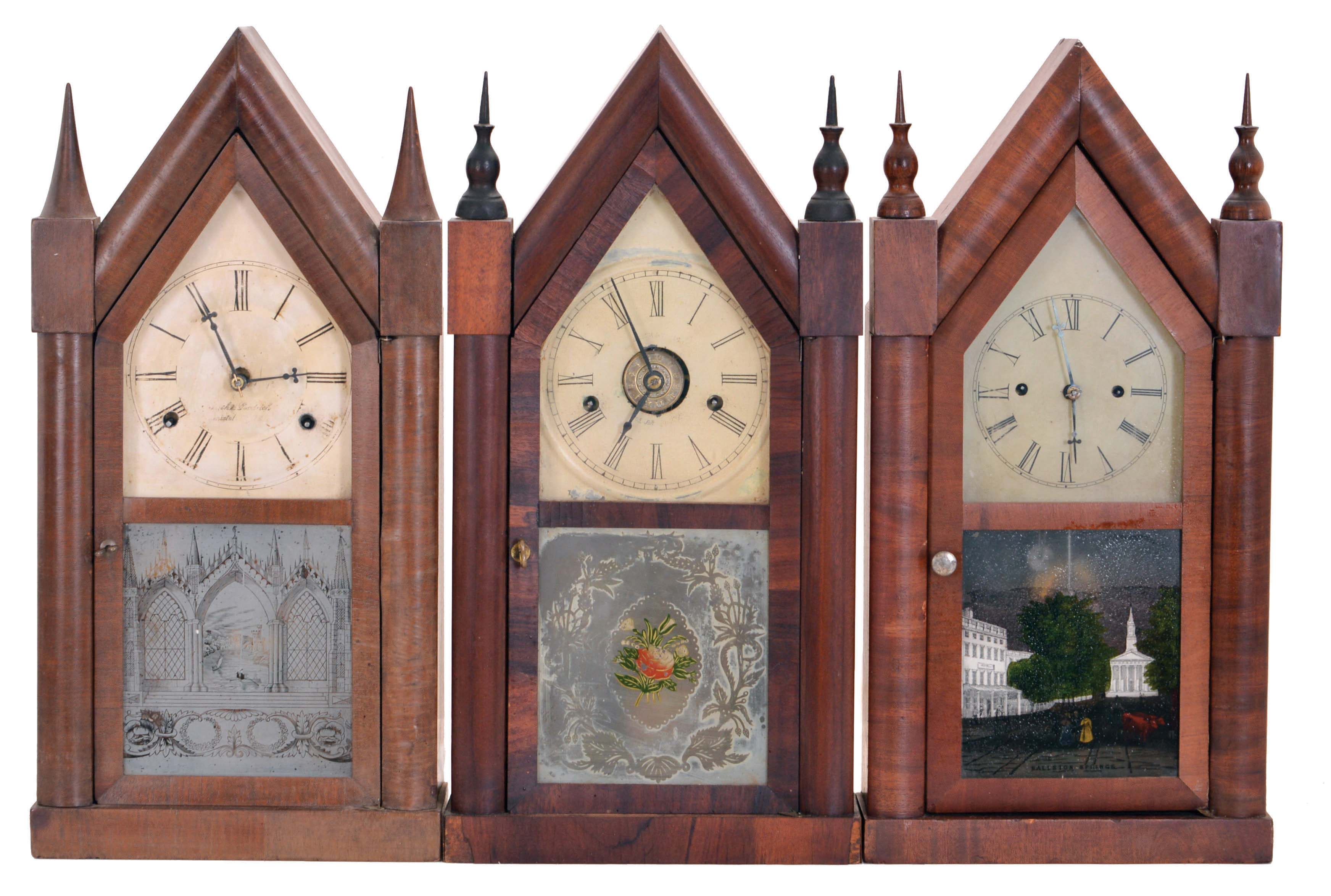 Clocks- 3 (Three): (1) Smith &amp; Goodrich, Bristol, Conn., 30 hour, time and strike spring driven, fusee movement sharp gothic or steeple clock, c1850; (2) Chauncey Boardman, Bristol, Conn., 30 hour, time, strike and alarm spring driven movement sharp gothic or steeple clock, c1850; (3) Elisha Manross, Bristol, Conn., 30 hour, time and strike spring driven movement sharp gothic or steeple clock, c1850. — Antique Clocks Price Guide