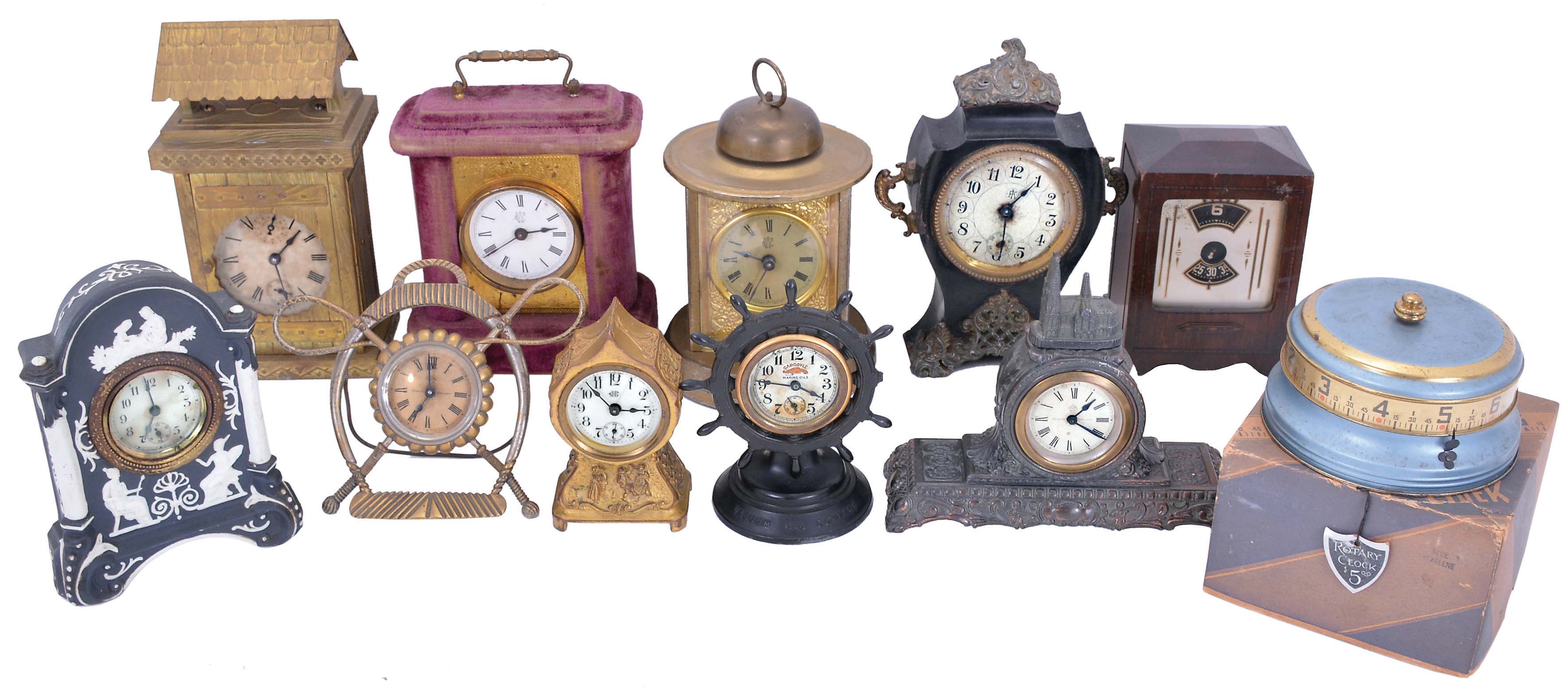 Clocks- 11 (Eleven) Novelty: Ansonia, "Stirrup" and clock with a miniature cathedral; one metal case and one plush clock by Waterbury; metal case clock depicting a roofed dwelling with balance wheel movement; novel electric clock that looks like a radio; ship's wheel clock advertising Gator Marine Oils; a black metal clock by Kroeber; small Jennings Brothers gilt brass clock with porcelain dial; Wedgewood case novelty clock; rotary mystery "tape measure" clock with original box and paper tag. — Antique Clocks Price Guide