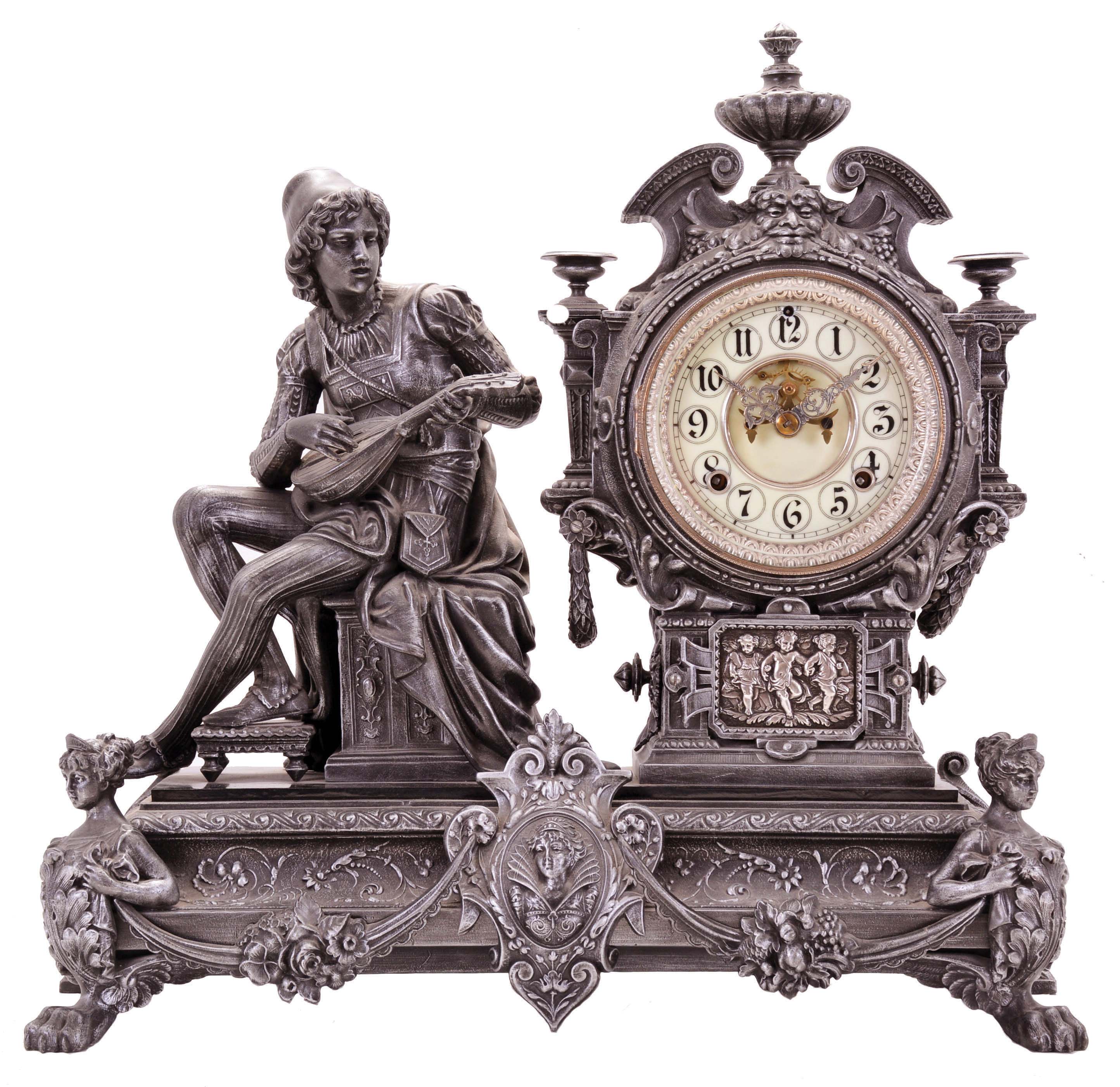 Ansonia Clock Co., New York, NY, "Bard" figural mantel clock with a spring driven, 8 day time and half hour strike movement in a spelter case on an enameled cast iron base. — Antique Clocks Price Guide
