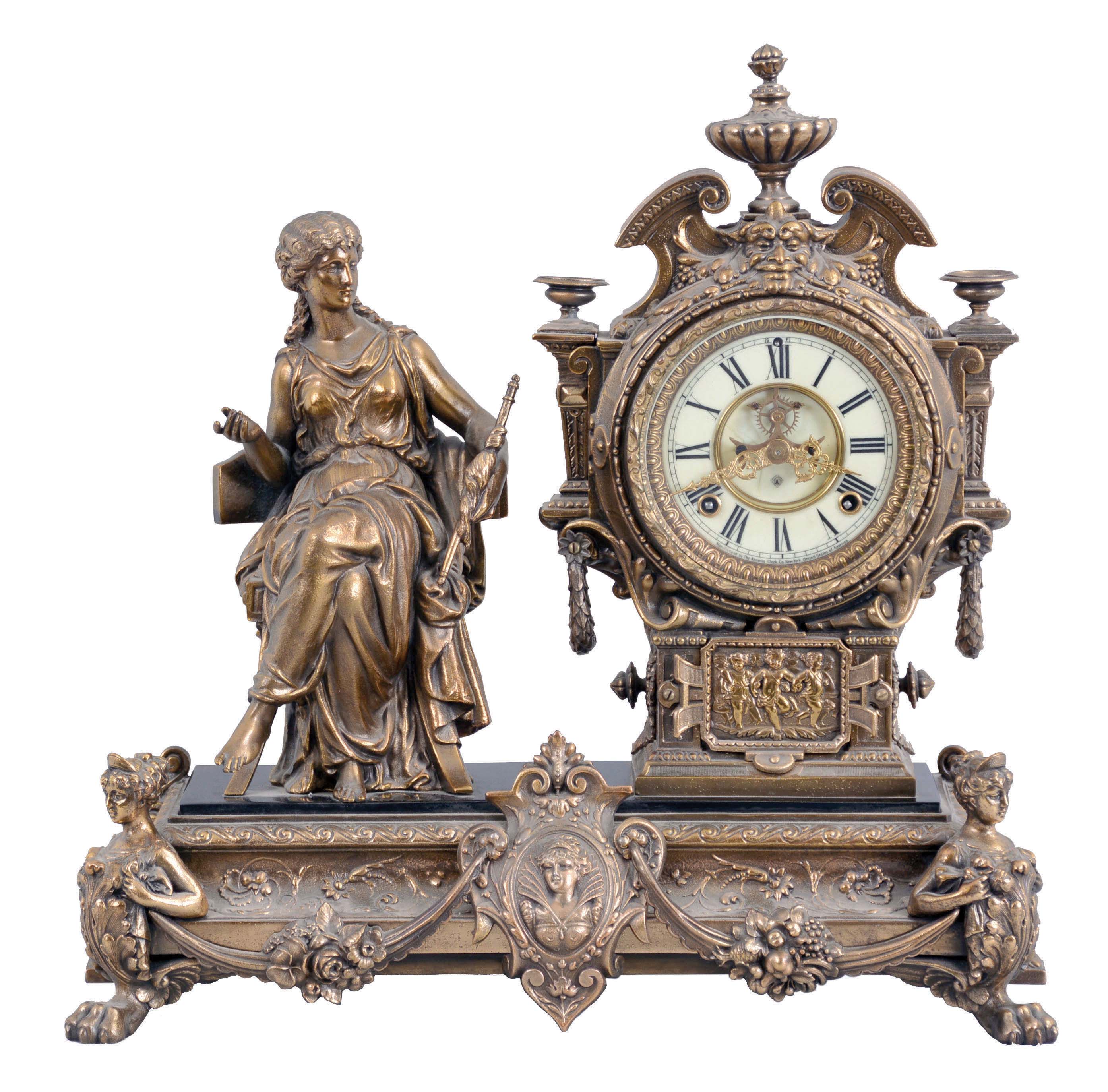 Ansonia Clock Co., New York, NY, "Prosperity" figural mantel clock with a spring driven, 8 day, time and strike movement with visible escapement in a cast metal and enameled iron case. — Antique Clocks Price Guide