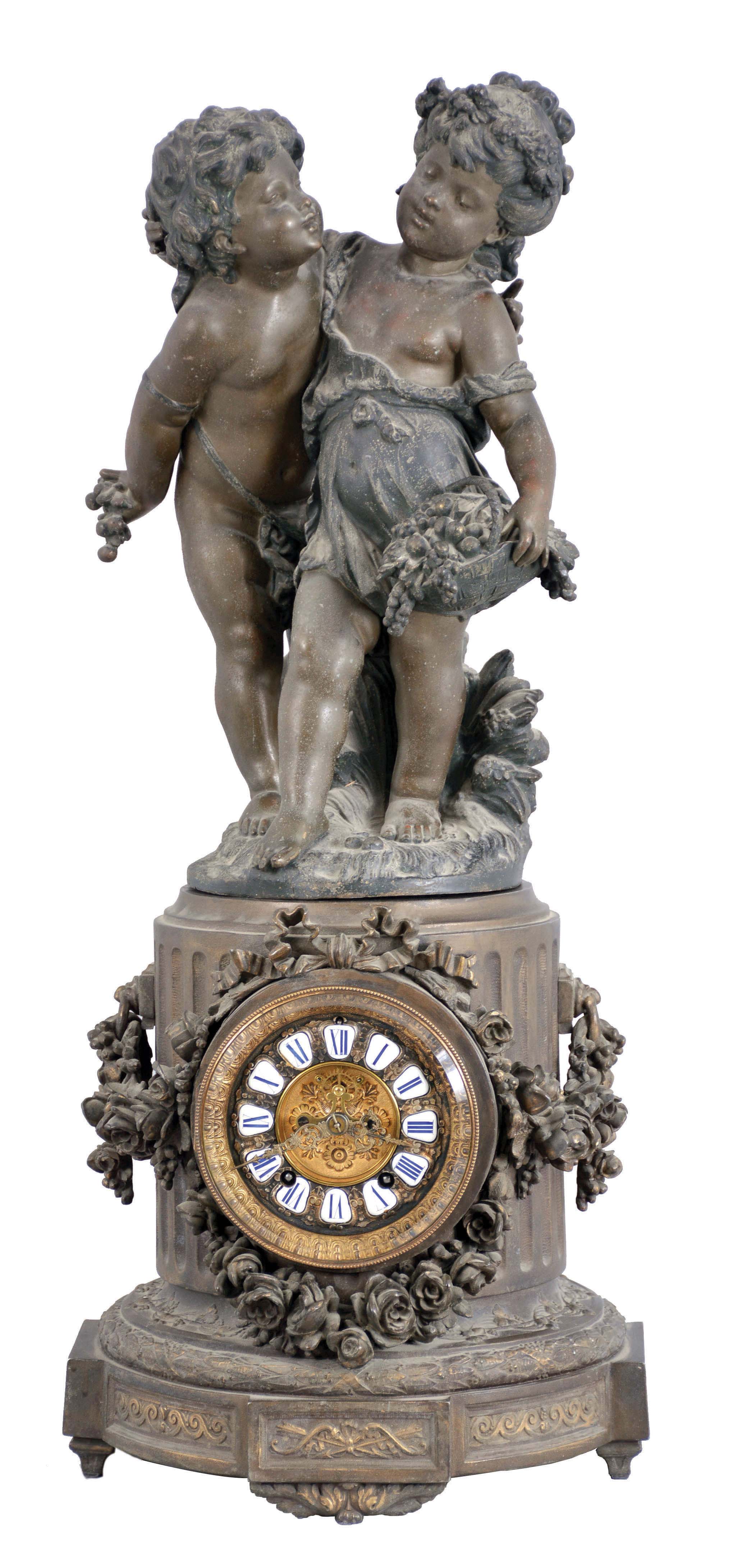 Ansonia Clock Co., New York, NY, "Florida"  base with 1089 group (Cherubs) figural shelf clock with a spring driven, 8 day, time and rack &amp; snail strike movement with visible escapement in a cast metal case with a Barbedienne finish. — Antique Clocks Price Guide