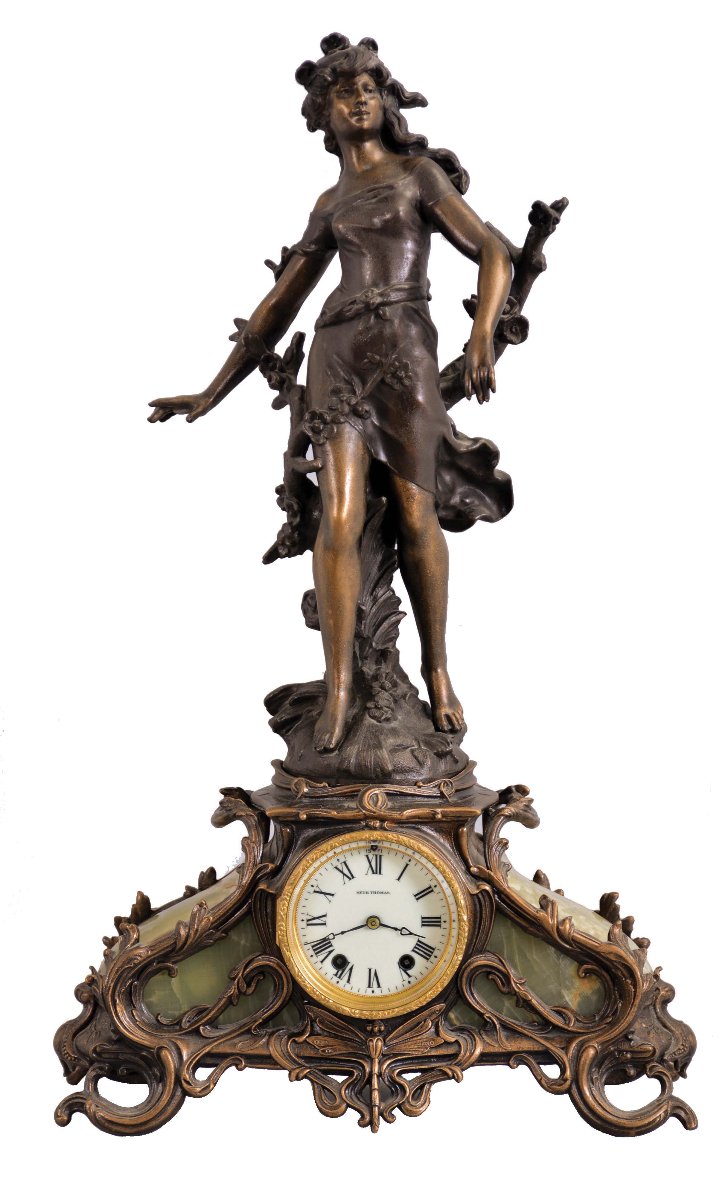 Seth Thomas Clock Co., Thomaston, Conn., "Vivien" figural mantel clock with a spring driven 15 day time and half hour strike movement in a cast metal and Brazilian Onyx case. — Antique Clocks Price Guide