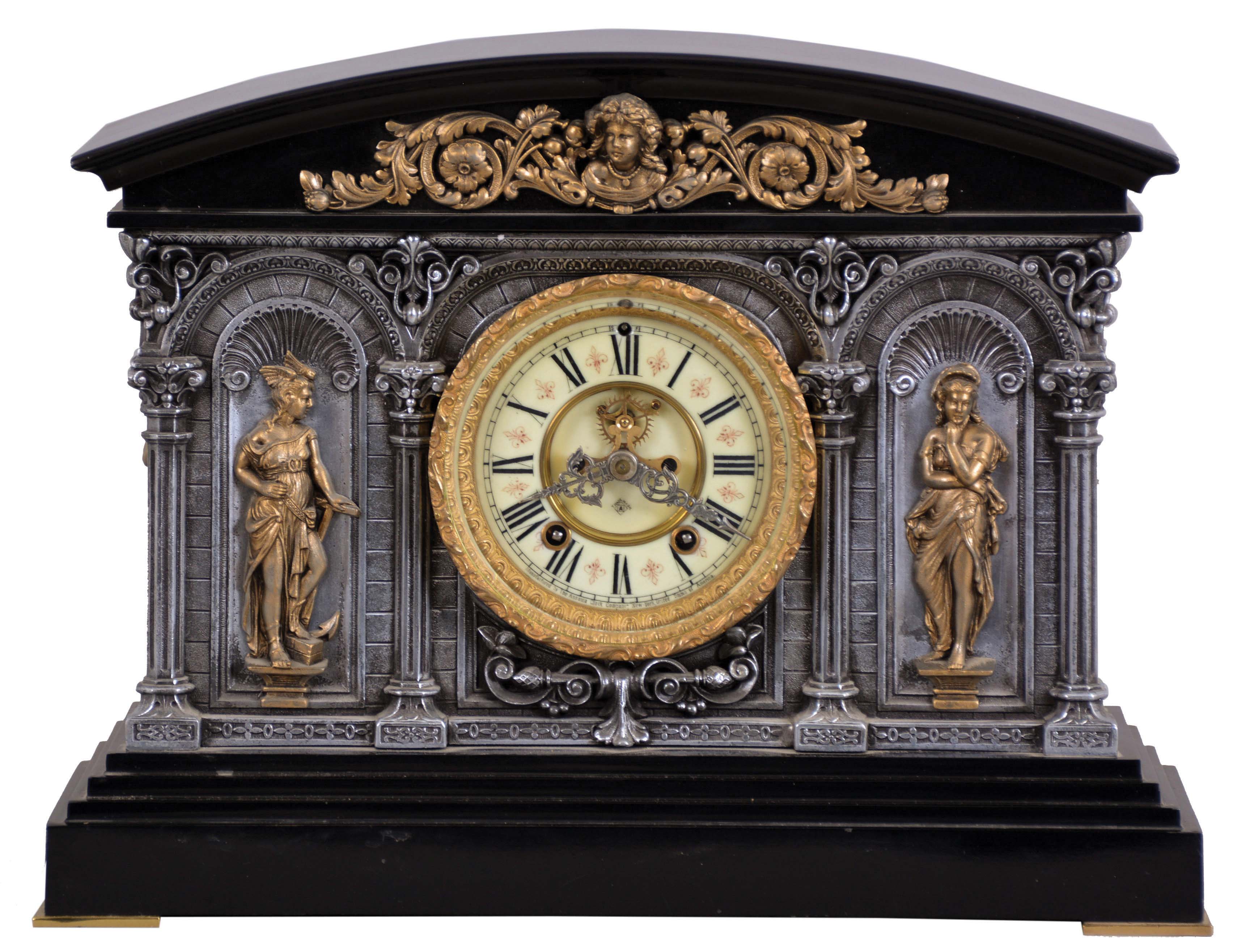 Ansonia Clock Co., New York, NY, "Georgia" mantel clock with a spring driven, 8 day, time and rack &amp; snail strike movement with visible escapement in a cast metal and enameled iron case. — Antique Clocks Price Guide