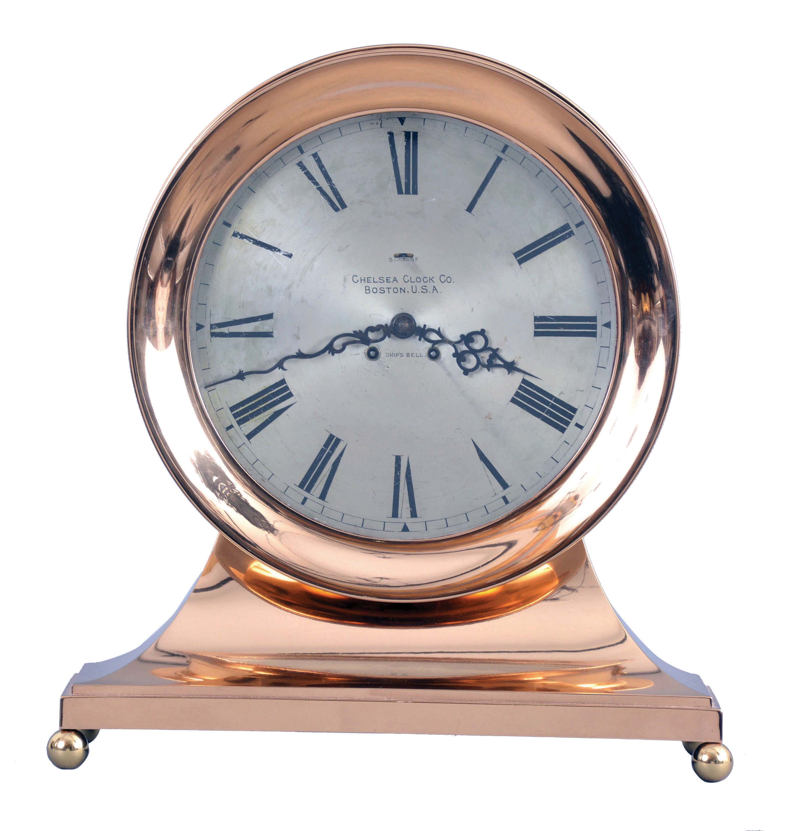 Chelsea Clock Co., Boston, Mass., retailed by Spaulding &amp; Co., Chicago, "Commander" on metal base with 8 1/2" special dial, 8 day, spring driven, time and ship's bell striking movement in a polished brass case mantel clock — Antique Clocks Price Guide