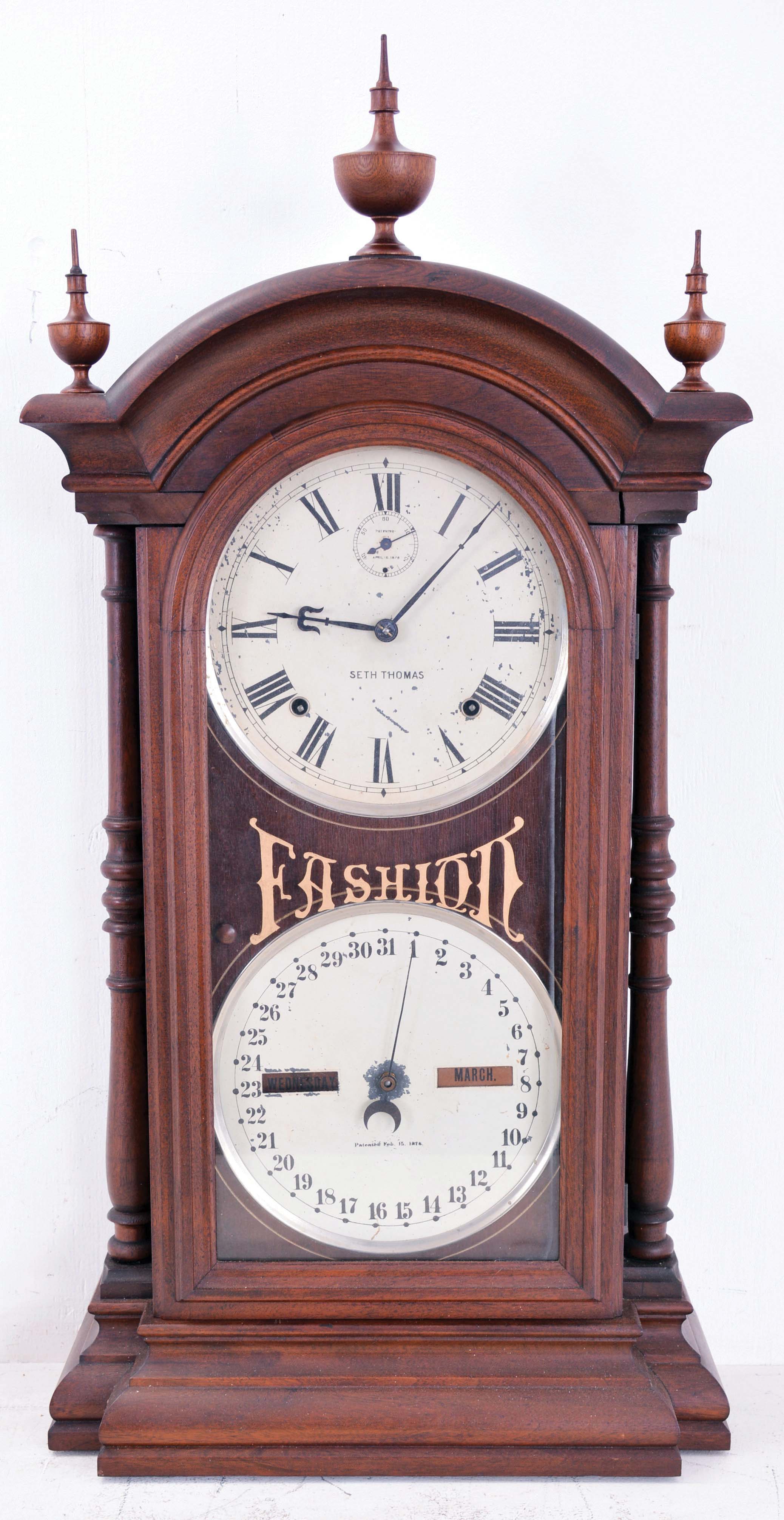 Southern Calendar Clock Co., St. Louis, Mo., "Fashion No. 5" double dial shelf clock with a Seth Thomas spring driven, 8 day, time and strike movement and a R. T. Andrews patented perpetual calendar mechanism in a walnut case. — Antique Clocks Price Guide