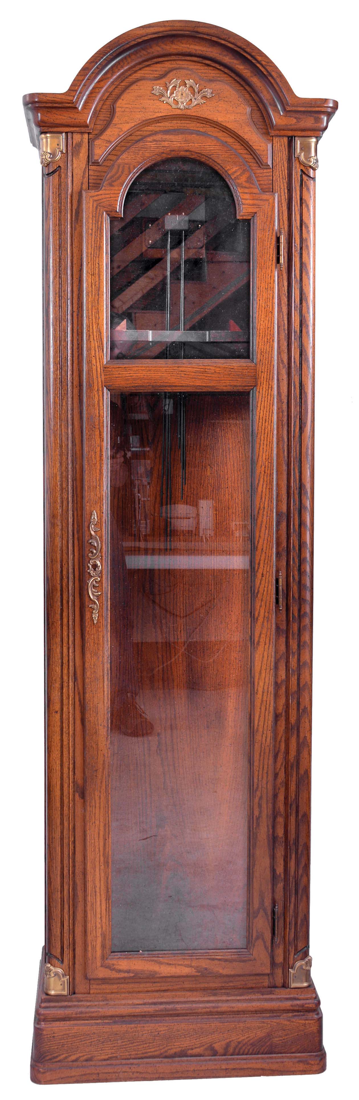 Clock Parts: (1) One modern tall clock case in oak; (2) 8 day weight driven 5-tube chime tall clock movement by Jauch; (3) Electrically driven 5-tube chiming tall clock movement by Revere Clock Co. of Cincinnati, OH with Telechrone synchronous motor and dial; (4) 6 sets of tubular chimes: one set of four, one set of seven, and four sets of five; (5) three tall clock pendulums. — Antique Clocks Price Guide