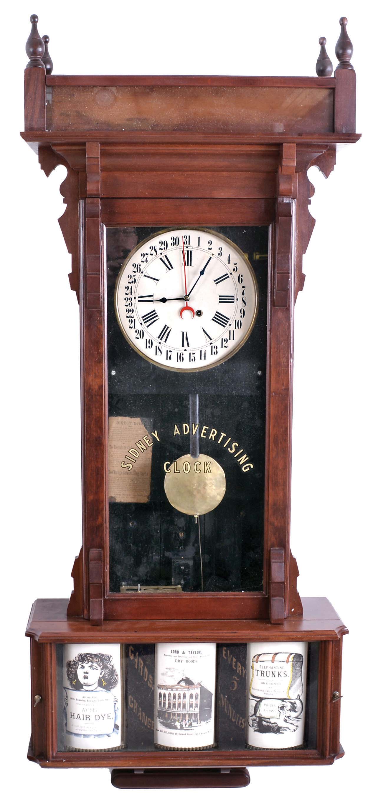 Sidney Advertising Clock Co., Sidney Otsego County, New York, huge "Advertising" wall clock, softwood case with reverse painted glass, the lower section with advertising rolls, rotating once every five minutes, papered metal dial, and 8 day, time and calendar, spring driven movement — Antique Clocks Price Guide