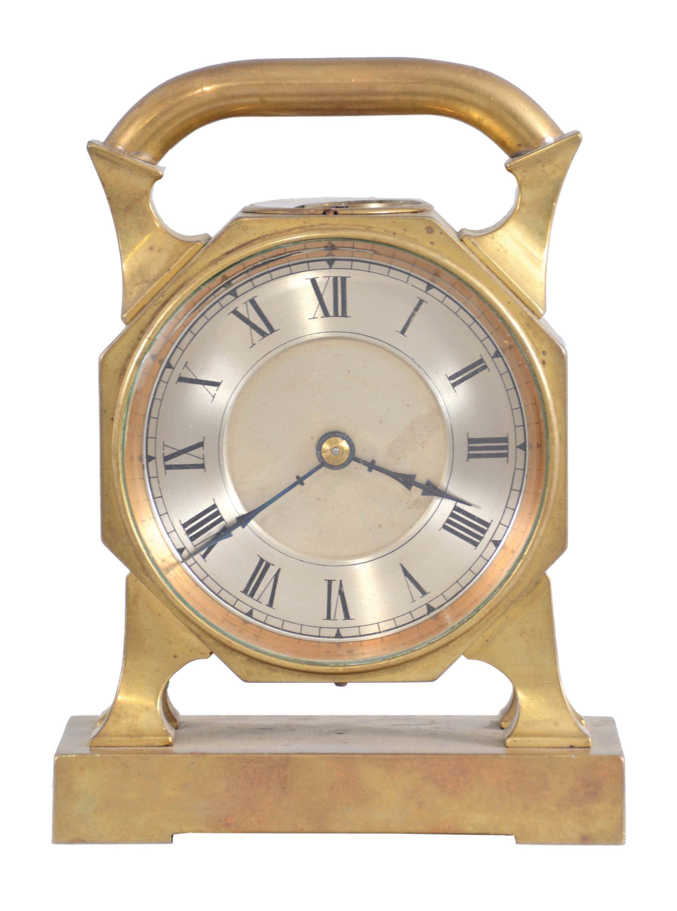 France, desk clock, 8 day timepiece with balance wheel movement and directional compass on a brass base supporting an octagonal case on four feet, topped with a handle, c1900. — Antique Clocks Price Guide