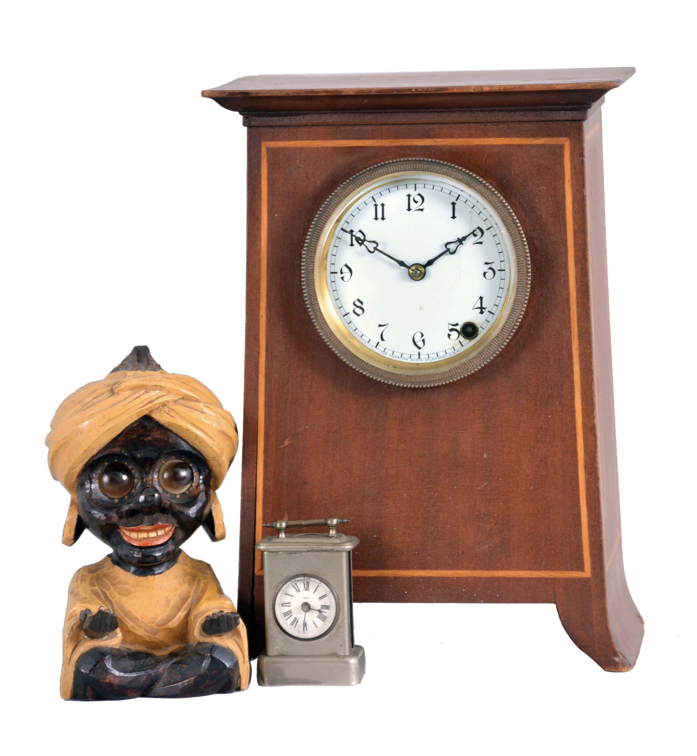 Clocks- 3 (Three) Desk and Novelty: (1) American Clock Co., Chicago, mantel clock, 8 day time only, spring driven movement in an inlaid mahogany case with white enamel dial showing Arabic numerals, c1930; (2) J. Oswald, Germany, "Sheik" rotating eye novelty clock of a seated figure with large earrings and turban with outstretched arms, c1950; (3) E.N. Welch, Forestville, Conn., "Little Corinne" miniature carriage clock, 30 hour time only movement in a nickel case with white enamel dial, c1889. — Antique Clocks Price Guide