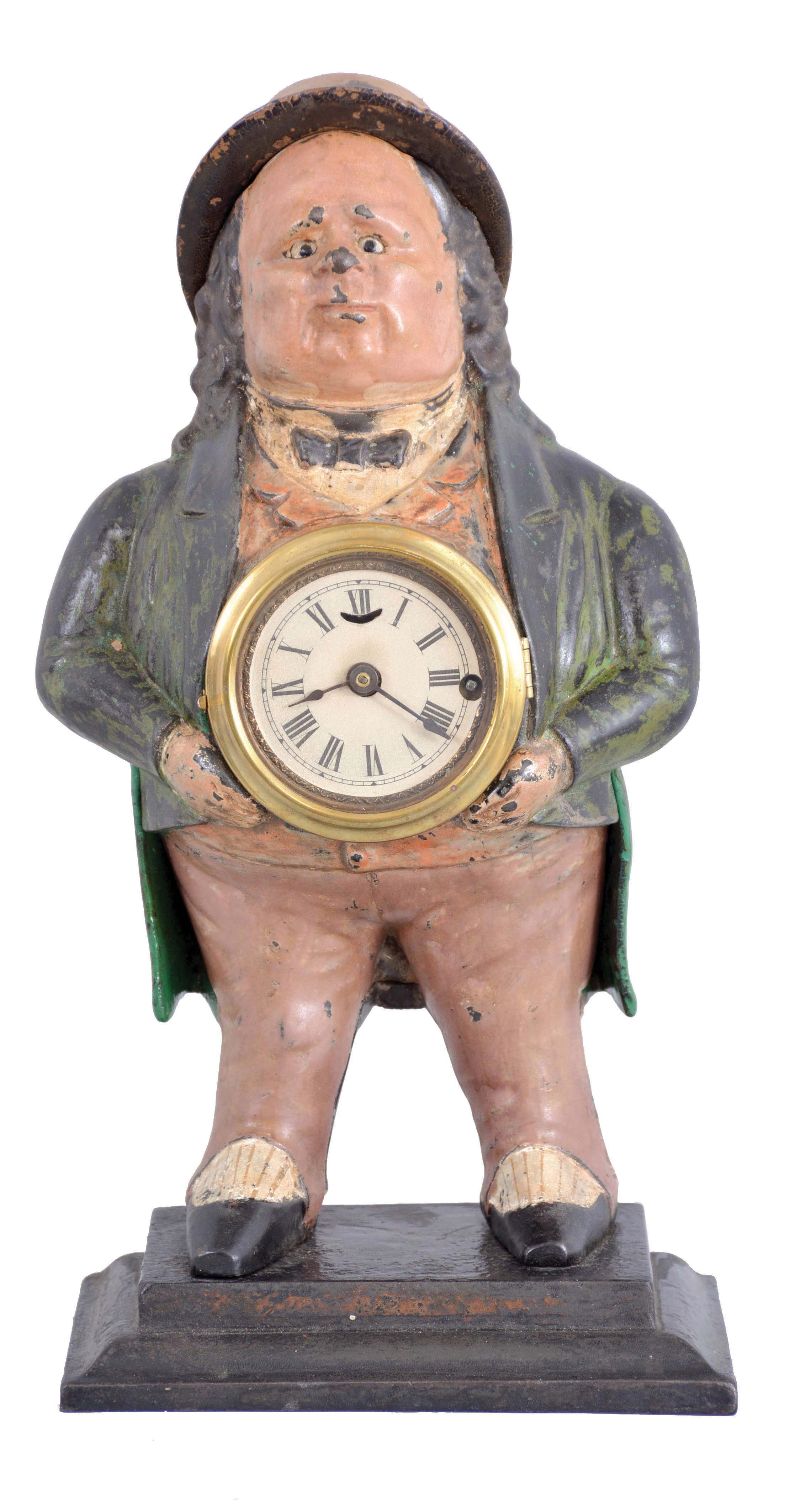 Bradley and Hubbard, Meriden, Conn., "John Bull" blinking eye clock with a spring driven, balance wheel timepiece, movement by C. Jerome, in a cast iron case. — Antique Clocks Price Guide