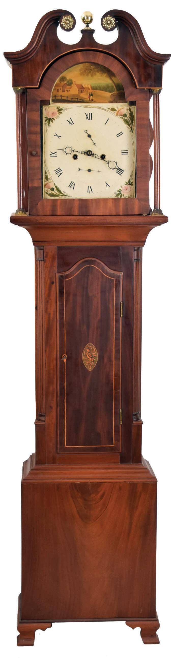 Scotland, unsigned tall clock, 8 day, time and bell strike, weight driven brass movement with painted metal dial in a mahogany inlaid oak case with broken arch top set with brass rosettes and finial, full columns flanking hood door and reeded quarter columns flanking trunk door, the door inlaid with bird, and on ogee bracket feet — Antique Clocks Price Guide