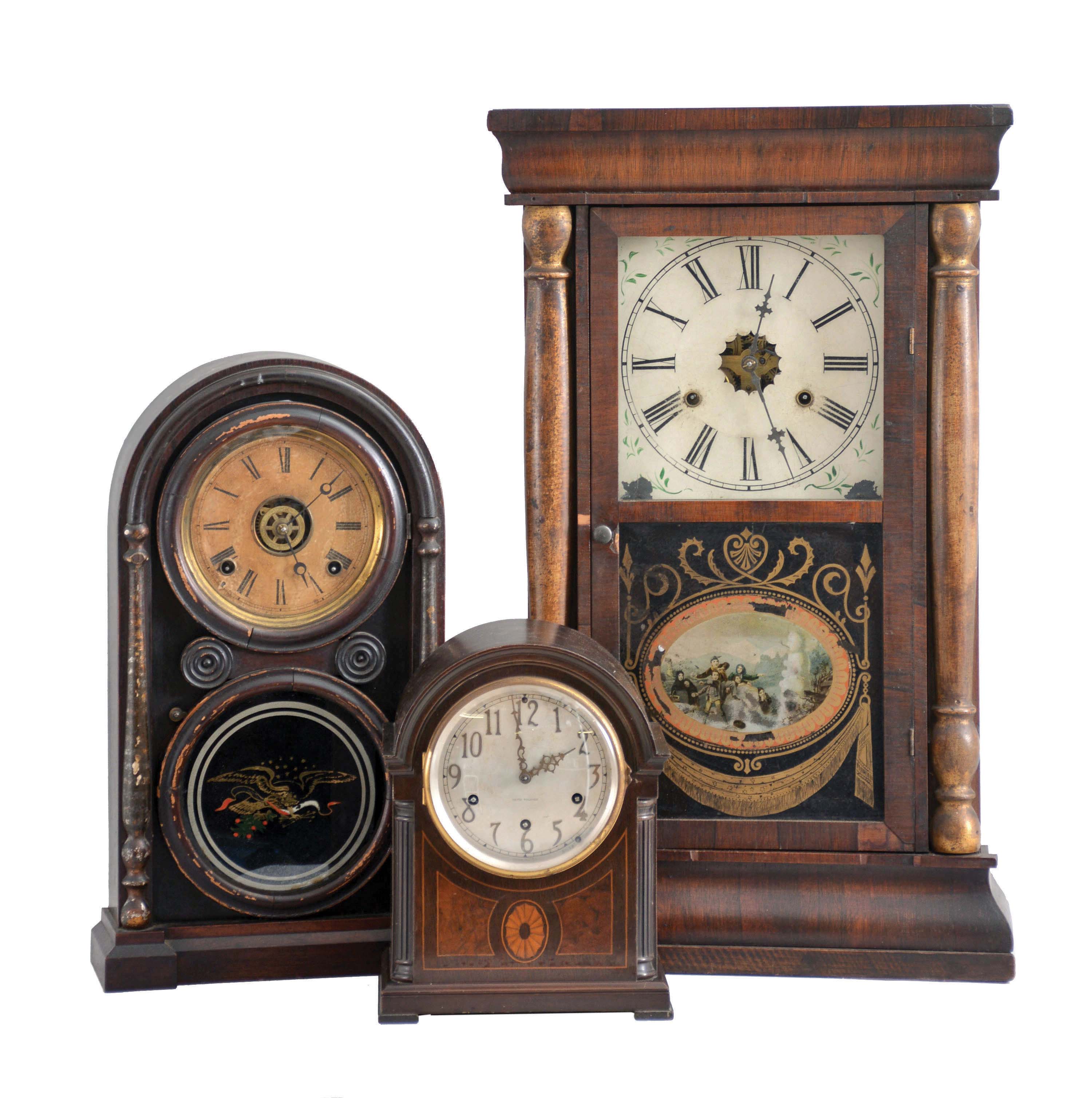 Clocks- 3 (Three): (1) Seth Thomas Clock Co., Thomaston, Conn., "Chime Clock No. 96", 8 day, time and strike Westminster chime spring driven movement mantel clock, c1913; (2) Daniel Pratt &amp; Sons, Reading, Mass., 8 day, time and strike spring driven movement round top shelf clock, c1870; (3) American, 30 hour, time and strike, weight driven brass movement column shelf clock, c1860 — Antique Clocks Price Guide