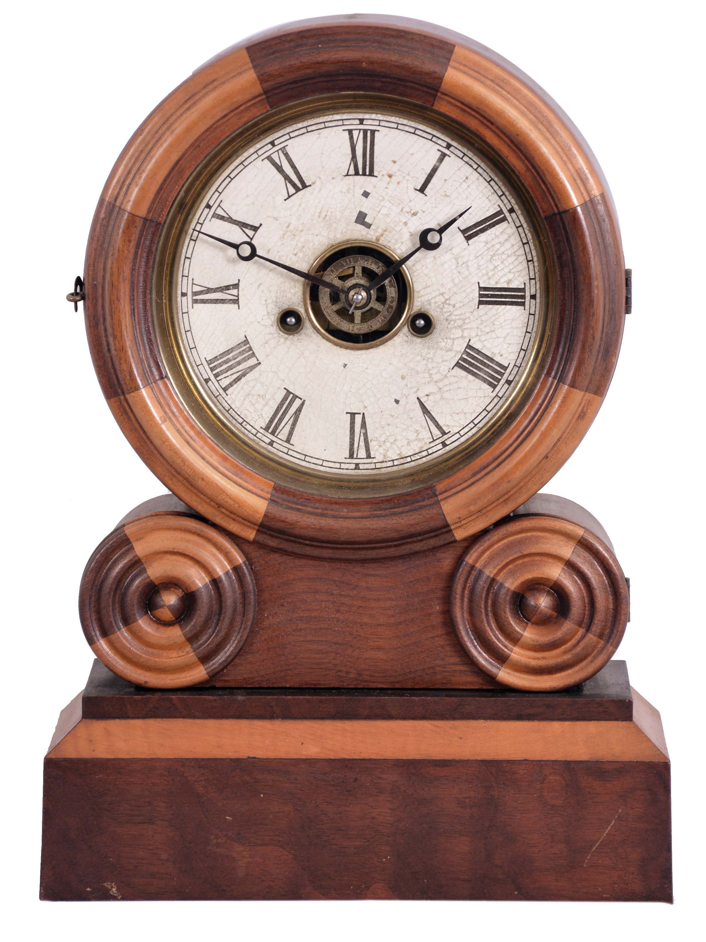 E. Ingraham &amp; Co., Bristol, Conn., "Grecian Mosaic" shelf clock with a spring driven 30 hour time, strike and alarm movement in a walnut and maple case. — Antique Clocks Price Guide
