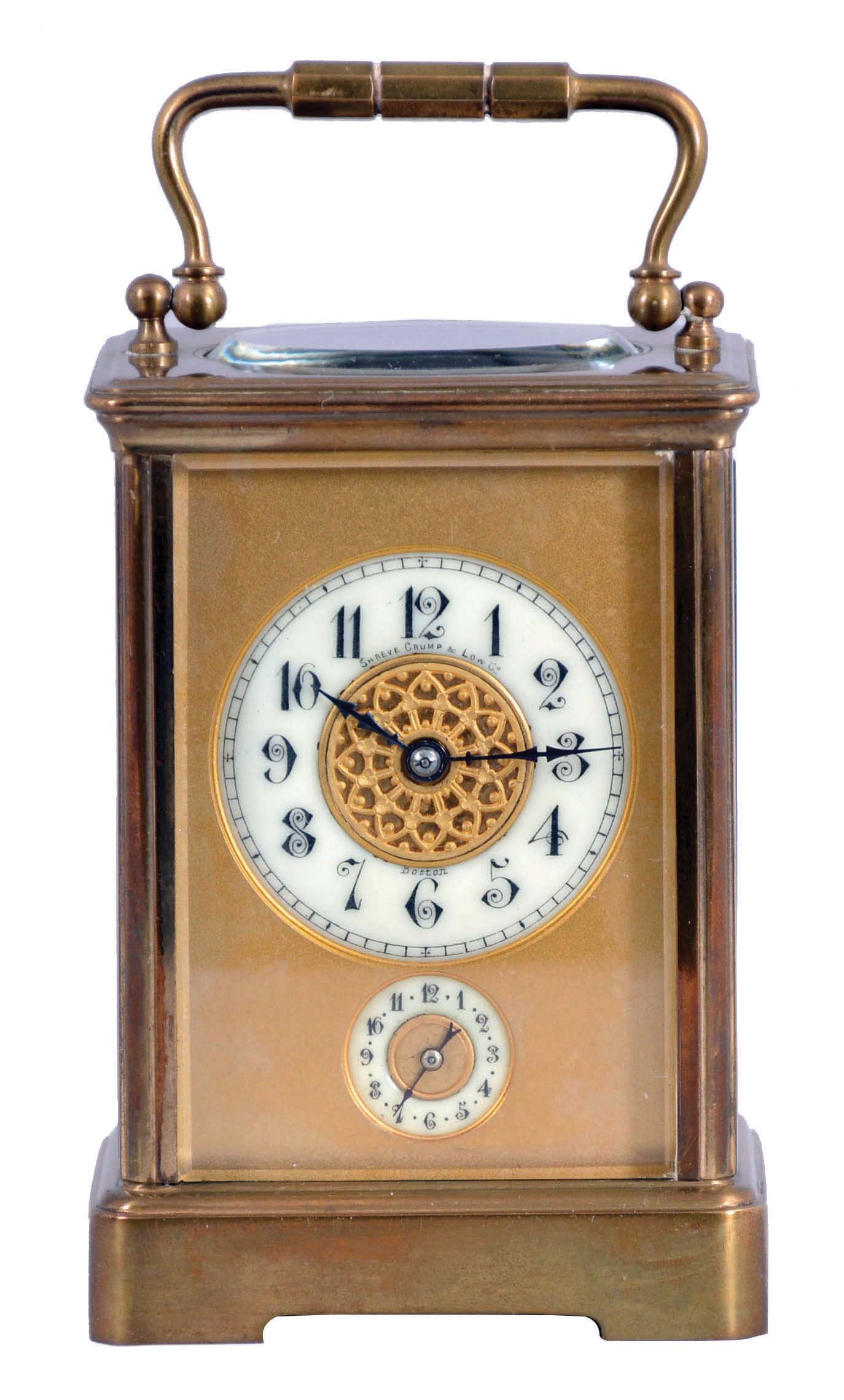 France, for Shreve, Crump &amp; Low, Boston, striking carriage clock with alarm, brass Corniche case with beveled glasses, Arabic numeral white enamel dial with gilt mask, and subsidiary alarm chapter, blued steel distaff style hands, 8 day striking movement with lever platform, sounding the hour and half hour in passing — Antique Clocks Price Guide