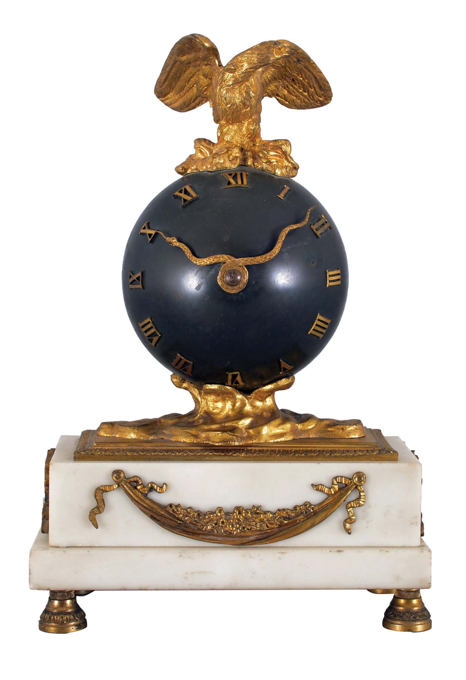 French mantel clock, 8 day, time only spring driven movement balance wheel movement on a white marble base with gilt metal ornaments, patinated spherical body with applied roman numerals, hands in the form of a snake, surmounted by a gilt cast metal eagle with outstretched wings. Diminutive round movement is stamped "FRENCH MAKE". — Antique Clocks Price Guide