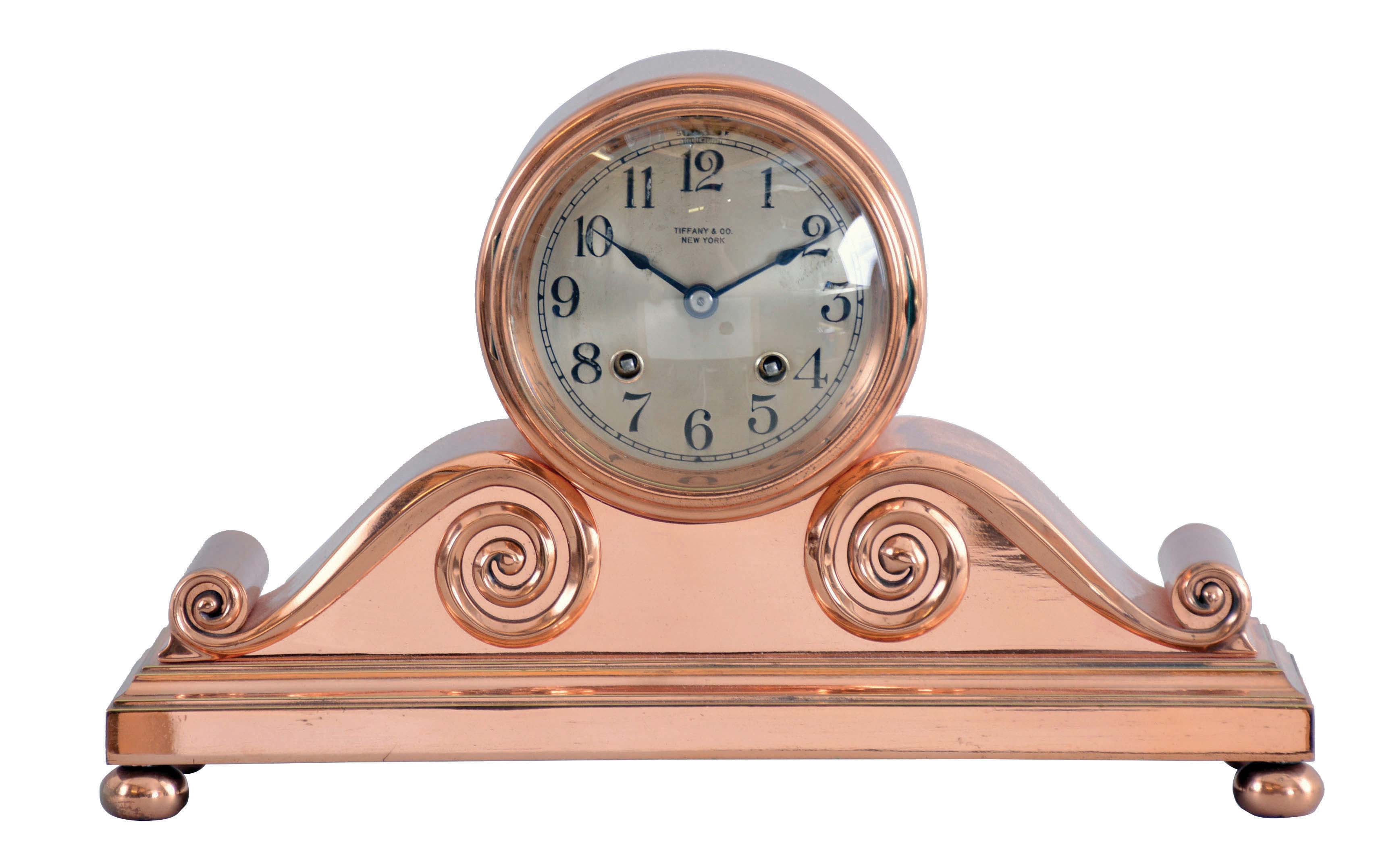 Chelsea Clock Co., Boston, Mass., for Tiffany &amp; Co., "Tambour No. 2", copper bronze case on compressed ball feet feet, 4" Arabic numeral silvered dial signed "Tiffany &amp; Co., New York", blued steel hands, 8 day time and house strike movement with lever escapement, serial #115819 — Antique Clocks Price Guide