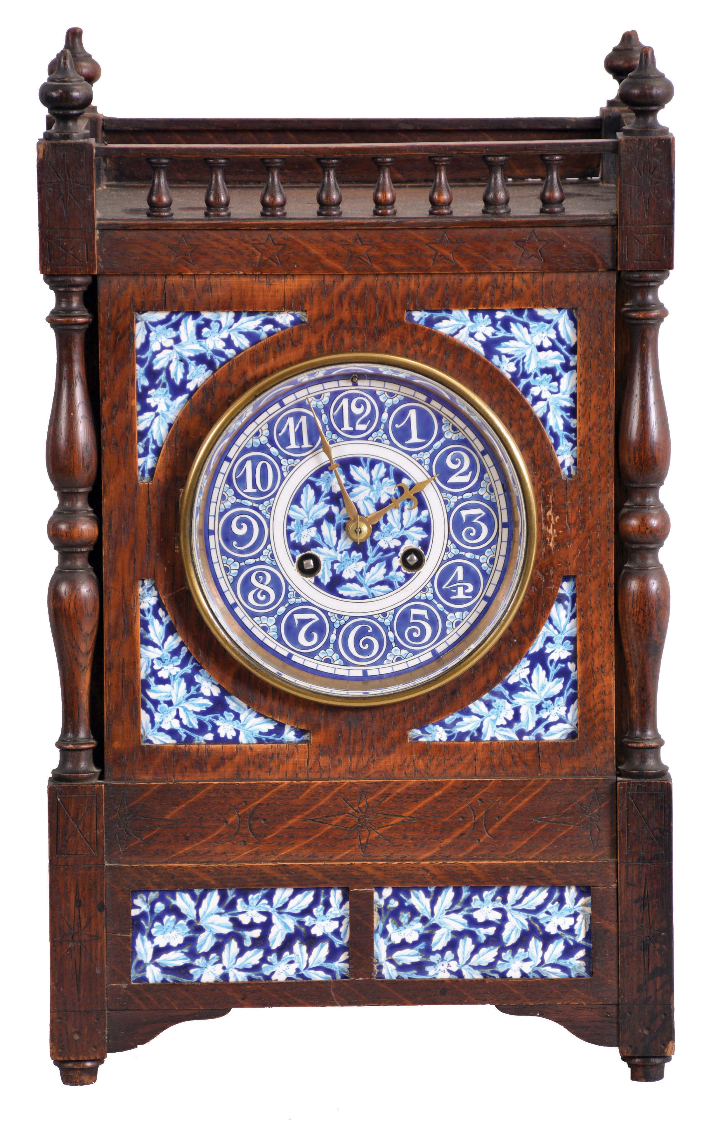 French, oak cased mantel clock with blue and white inserts and dial, 8 day, time and strike, with a movement stamped "C. J. &amp; Co.", the case with turned corner columns and finials. — Antique Clocks Price Guide