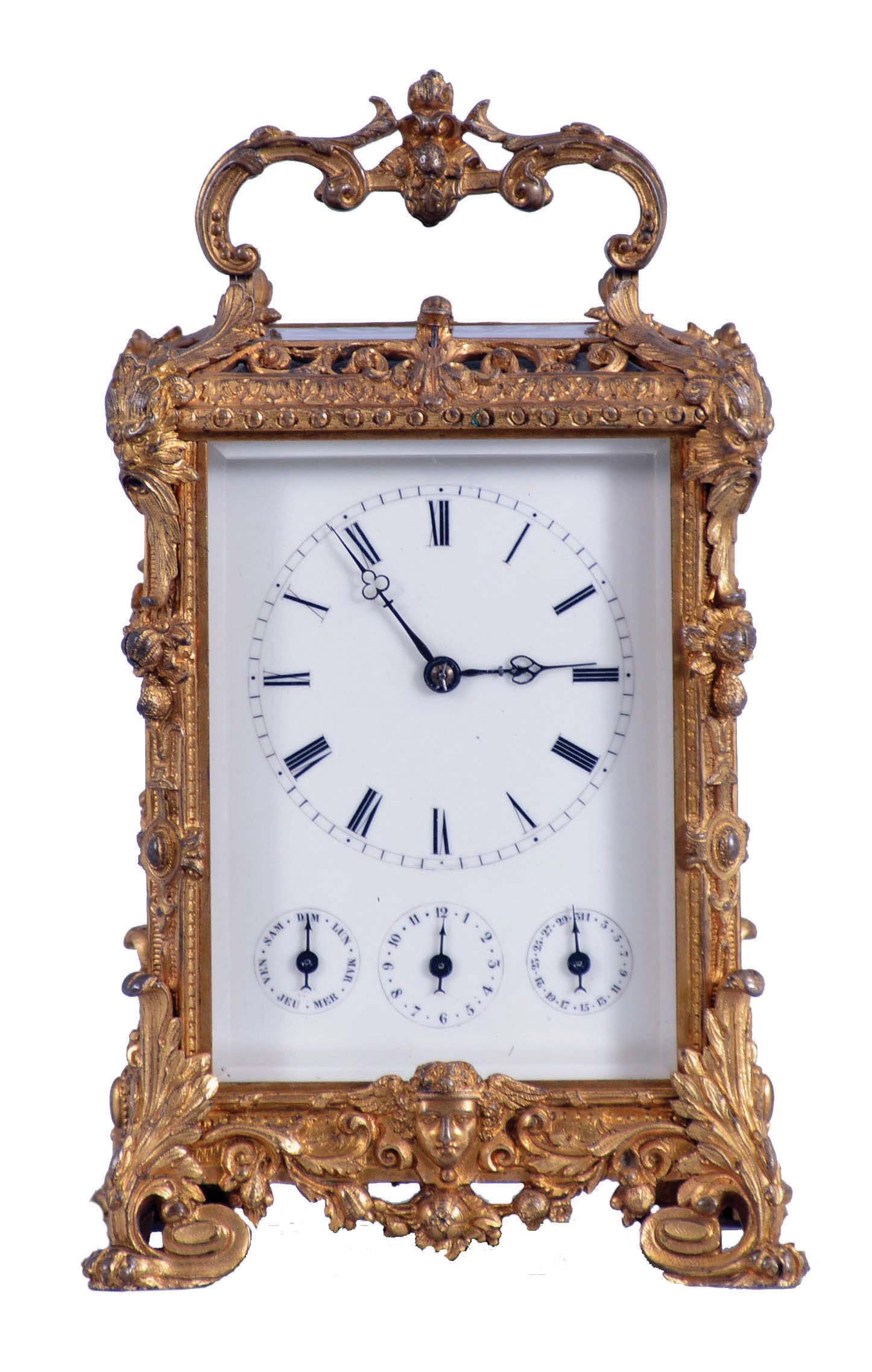 Dent, Paris, a very decorative repeating carriage clock with simple calendar and alarm, the cast, gilt case on hybrid paw feet with acanthus and scroll ornament, base with male mask above a foliate festoon, the top corners with acanthus ornamented masks and foliate pendants, and the top bordered with bead and leaf decorated moldings below an openwork, reinceaux fret, Roman numeral white enamel dial with subsidiary displays for alarm, day, and date, blued steel trefoil hands, 8 day, time and strike movement with lever platform, striking the hour and half hour in passing, and repeating the last hour on demand — Antique Clocks Price Guide