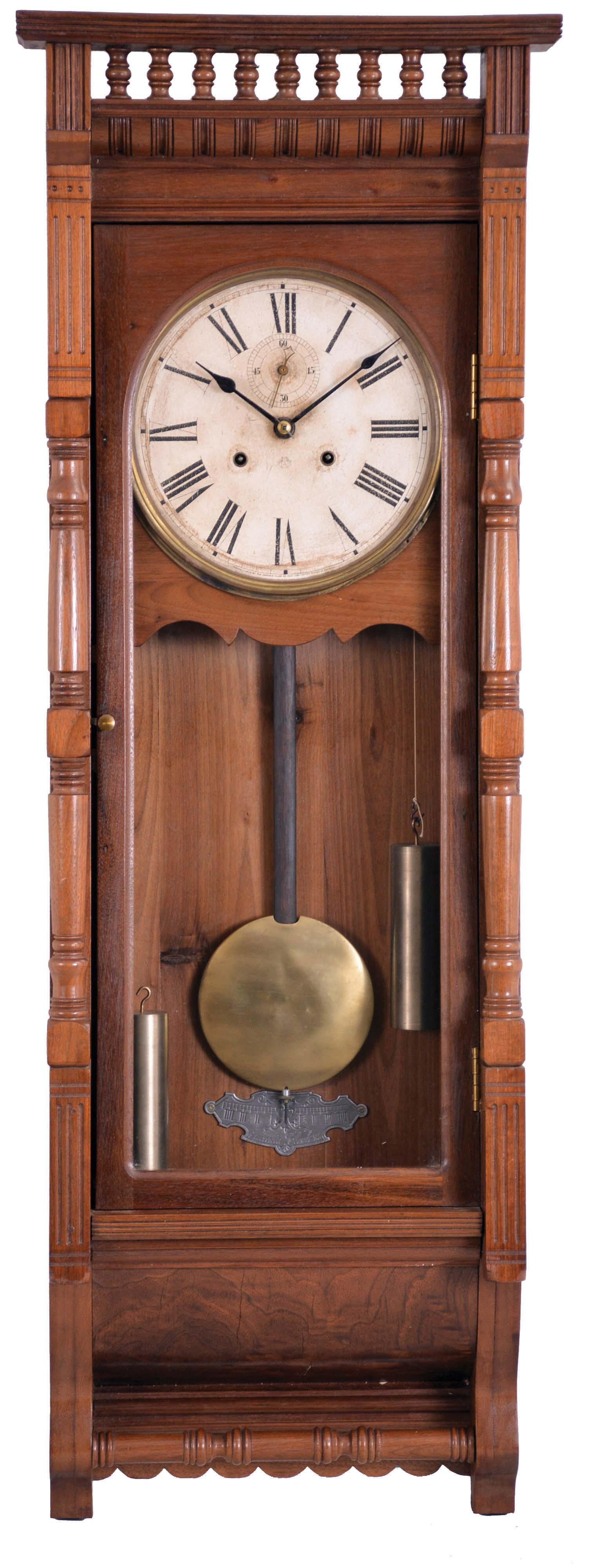 Ansonia Clock Co., New York, NY, "Santa Fe" wall hanging clock with a double weight driven timepiece movement in a walnut case. — Antique Clocks Price Guide