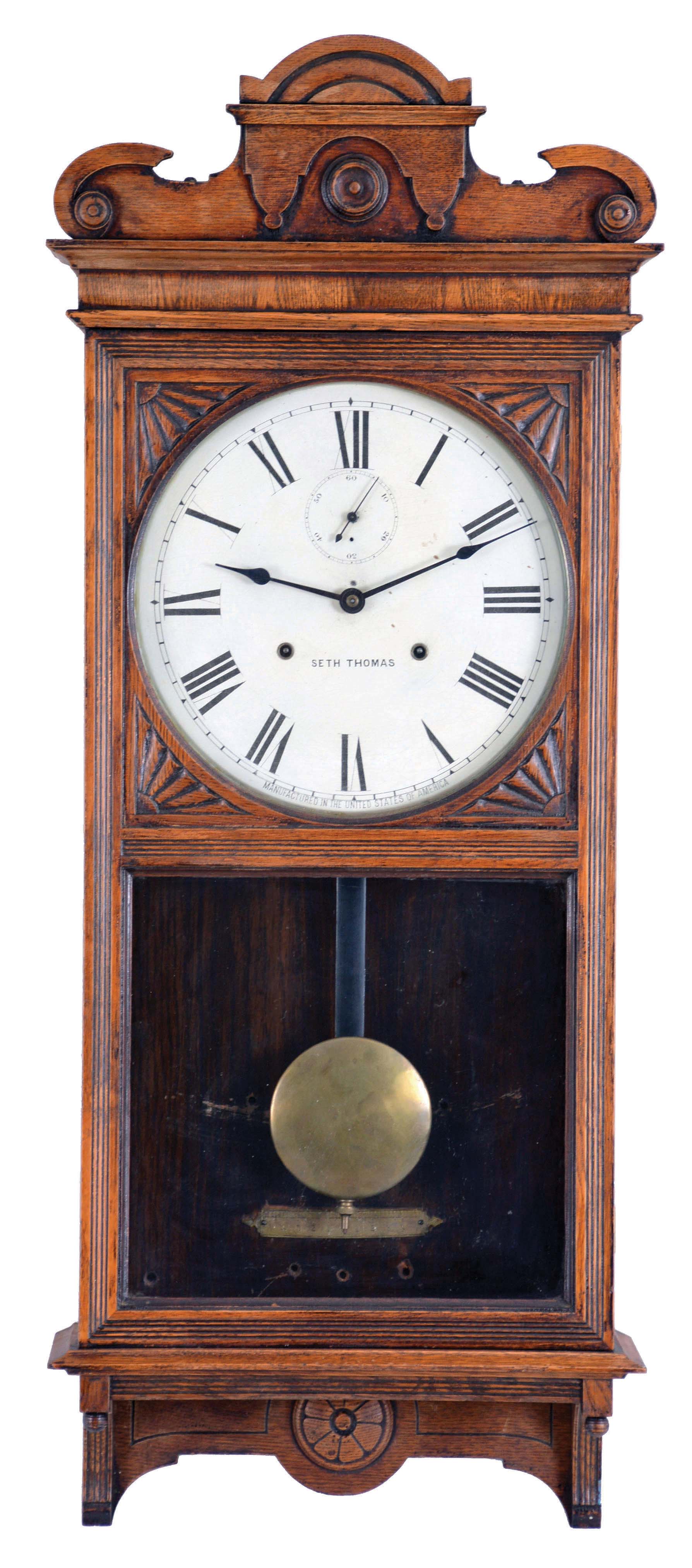 Seth Thomas Clock Co., Thomaston, Conn., "Office 30 Day - Variant" wall hanging clock with a spring driven 30 day timepiece movement in an "old oak" case. — Antique Clocks Price Guide