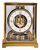 Jaeger LeCoultre, Switzerland, "Atmos" gilt brass and glass perpetual mantel clock, serial number 98063, front door hinges from side, in original green felt carrying box