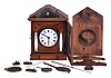 Germany, early Biedermeier cuckoo clock, 30 hour, weight driven movement in a wood case with stenciled floral design, fluted porcelain columns with gold accents and a white porcelain dial. Likely by Theodor Ketterer of Furtwangen, c1860.