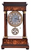 Austria, a mid 19th century portico clock with grand sonnerie striking, the case with rosewood veneers, ripple moldings, and contrasting, foliate marquetry, the columns with cast capitals and bases, Roman numeral silvered dial, blued steel hands, two day brass movement sounding the quarters in passing, and repeating the last hour and quarter on demand, silk suspended pendulum with engine turned rim, and decorative, pierced center