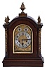 Germany, Junghans, 8 day, Westminster Chime, mahogany cased Georgian style bracket clock with fancy arched dial and pineapple finials