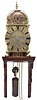 English lantern clock signed "Henry Lintott in Farnham, fecit." Brass case with turned columns, feet and finials, case front with pierced dolphin fret, top with brass bell cage and turned finial, engraved Roman numeral brass dial with engraved center and single, decorated steel hand, 30 hour brass movement with verge escapement and count wheel striking, and brass clad lead weight, together with a 20th century, purpose made bracket for hanging. Henry Lintott, age about 24, bachelor, of Farnham, Surrey, was granted a license to marry Mrs. Mary Mabberly, of Farnham, aged about 22, with consent of her mother, May 18, 1691. The will of Henry Lintott, Watchmaker, of Farnham, Surrey, was probated Apr. 14, 1705 in the Prerogative Court of Canterbury.