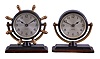 Clocks- 2 (Two) Chelsea Clock Co: (1) "Comet", 8 day, timepiece with 2.75 inch dial in a bronze case with yellow brass cradle and spokes mounted to a mahogany base, c1960; (2) "Haley", 8 day, timepiece with 2.75 inch dial in a bronze case with yellow brass cradle mounted to a mahogany base, c1960