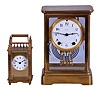 Clocks- 2 (Two) Brass & Glass: (1) Seth Thomas Clock Co., Thomaston, Conn., "Empire No. 200 EXTRA" crystal regulator, 8 day, time and gong strike with round brass movement, c1921. (2) Boston Clock Co., Chelsea, Mass., "Queen Anne" carriage clock, 8 day, timepiece with platform escapement in a gilt brass case with three beveled glasses and white enamel dial showing Roman numerals. Dedicated on the back to "Jeannie", c1890.