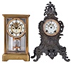 Clocks- 2 (Two) American: (1) Ansonia Clock Co., Brookline NY, "Prism" crystal regulator, 8 day time and strike, spring driven with visible escapement; (2) New Haven Clock Co., New Haven CT, "Arnold" metal case mantel clock, 8 day, time and strike with porcelain dial.