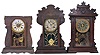 Clocks- 6 (Six) Gingerbread, time and strike, 8 day, spring driven, 3 (Three) with alarm. Makers include Seth Thomas and Waterbury. Also included in this lot are 6 (Six) wall-mounted wood shelves suitable for displaying clocks.