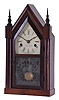 J. C. Brown, Forestville Manufacturing Co., Bristol, Conn., miniature steeple shelf clock with a 30 hour spring driven time and strike movement in a mahogany veneered case. Signed 30-hr time and strike movement.