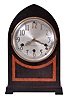 Seth Thomas Clock Co., Thomaston, Conn., "Chime No. 95" shelf clock with an eight day spring driven time and Westminster strike movement (124A) chiming on rods, in a two tone mahogany veneered case with a silvered dial and raised bronze numerals.